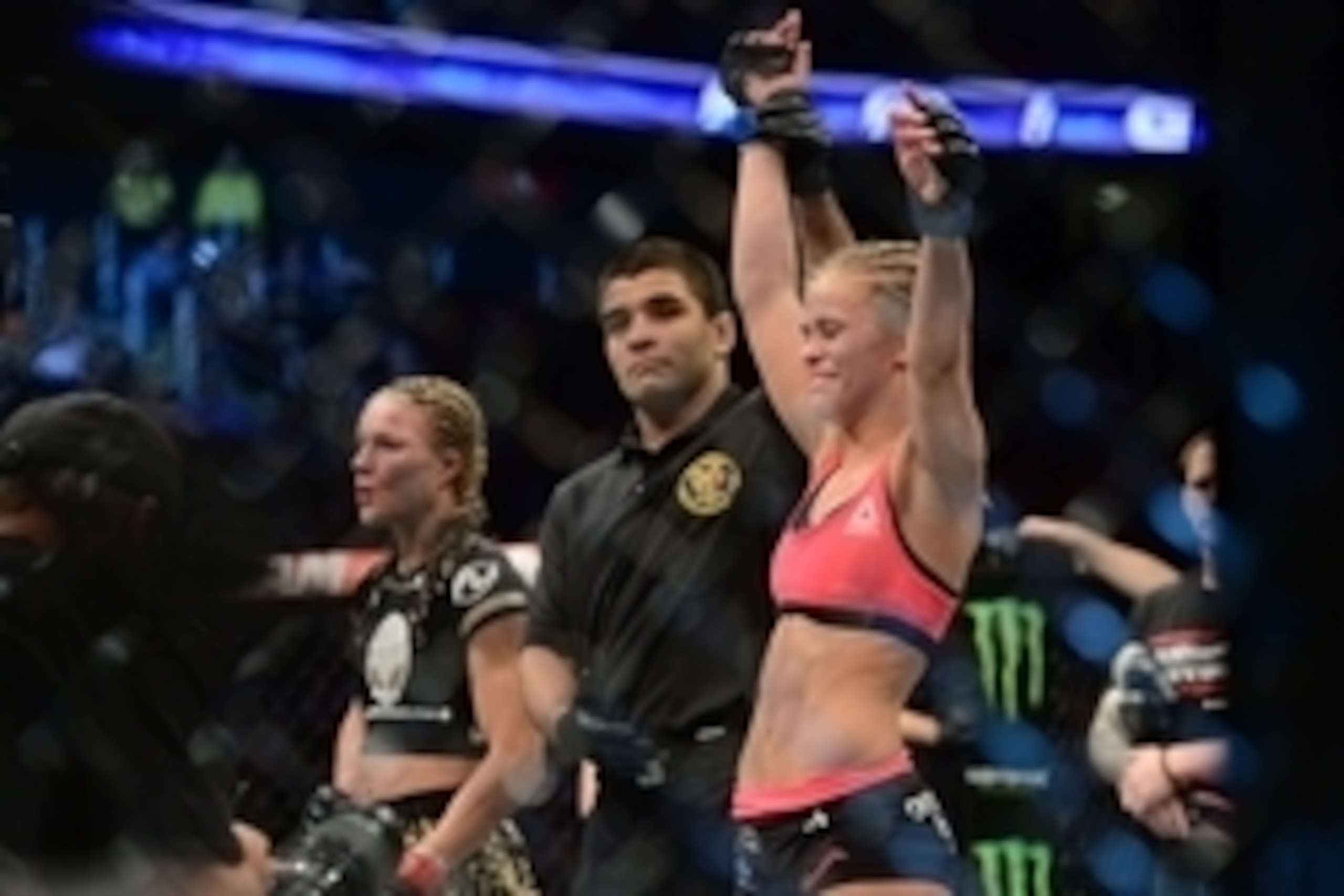 Apr 18, 2015; Newark, NJ, USA;  Paige VanZant (blue) celebrates after her fight against Felice Herrig (red) during UFC Fight Night at Prudential Center. VanZant won via unanimous decision. Mandatory Credit: Joe Camporeale-USA TODAY Sports