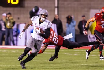 Sep 27, 2014; Salt Lake City, UT, USA; Washington State Cougars wide receiver Vince Mayle (1) runs past Utah Utes defensive back Marcus Williams (20) and scores a touchdown during the second half at Rice-Eccles Stadium.  Washington State Cougars won the g