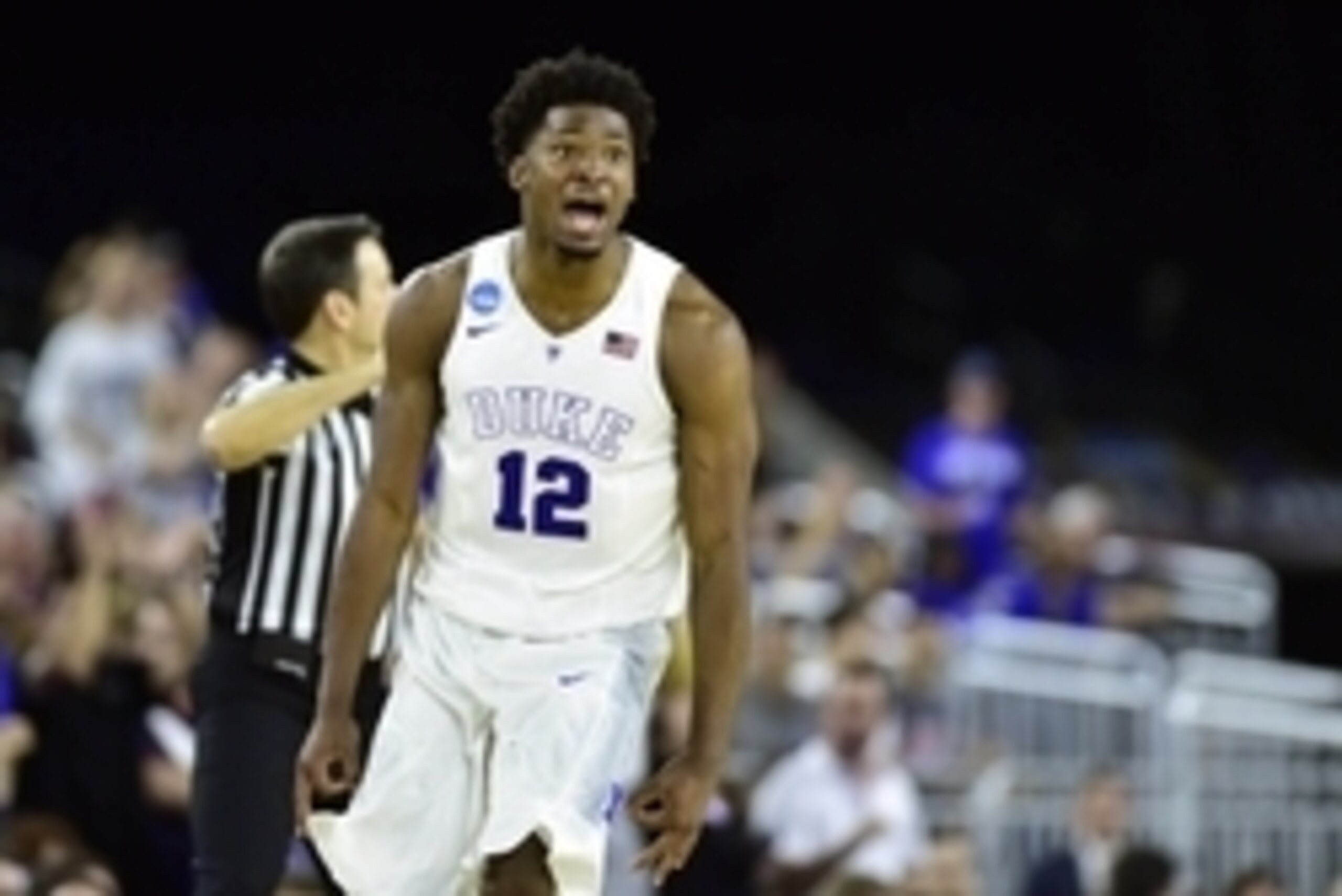 Mar 29, 2015; Houston, TX, USA; Duke Blue Devils forward Justise Winslow (12) celebrates after making a three-point basket against the Gonzaga Bulldogs during the second half in the finals of the south regional of the 2015 NCAA Tournament at NRG Stadium. 