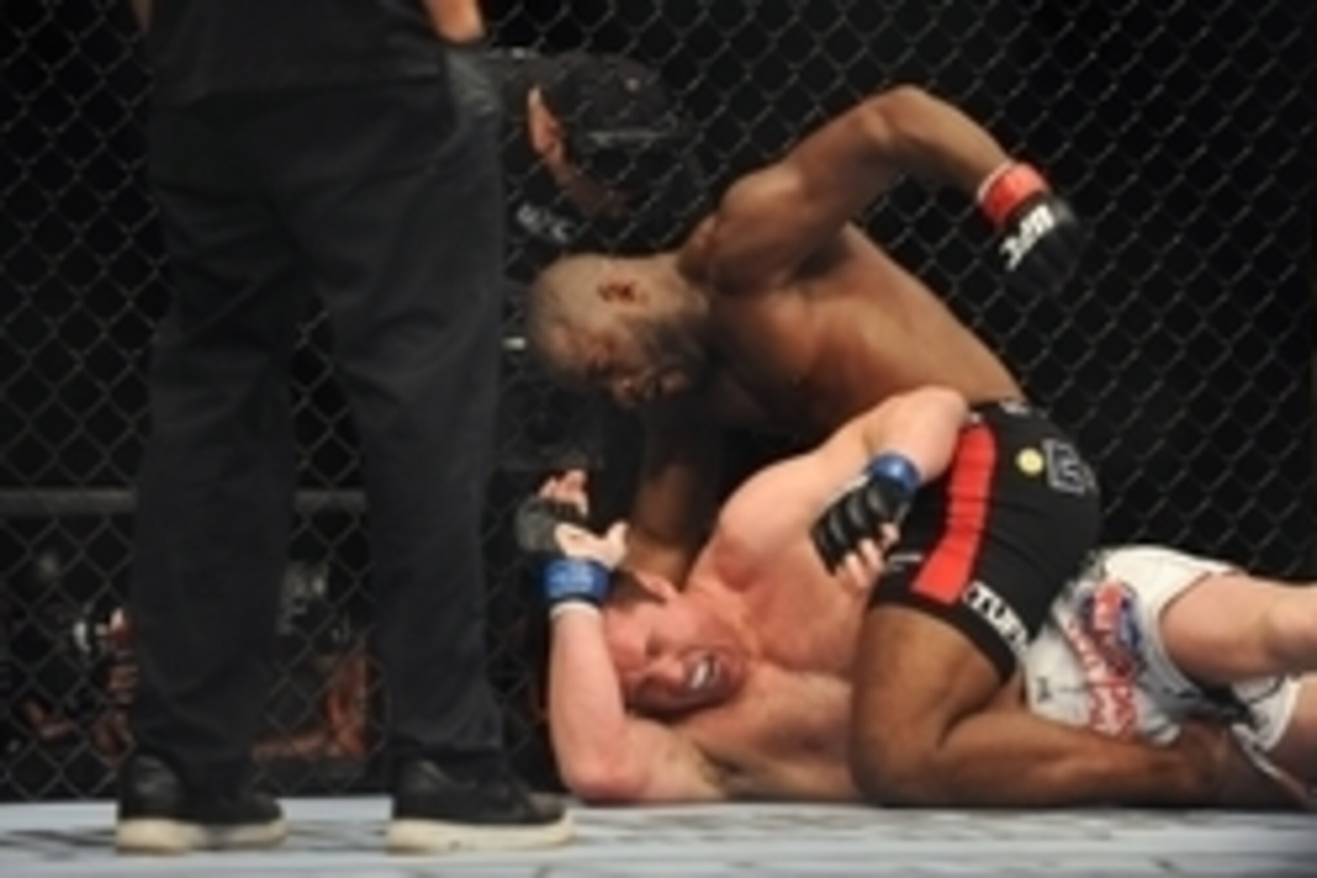 Nov 16, 2013; Las Vegas, NV, USA; Rashad Evans (red gloves) fights against Chael Sonnen (blue gloves) in their light heavyweight bout during UFC 167 at MGM Grand Garden Arena. Mandatory Credit: Stephen R. Sylvanie-USA TODAY Sports