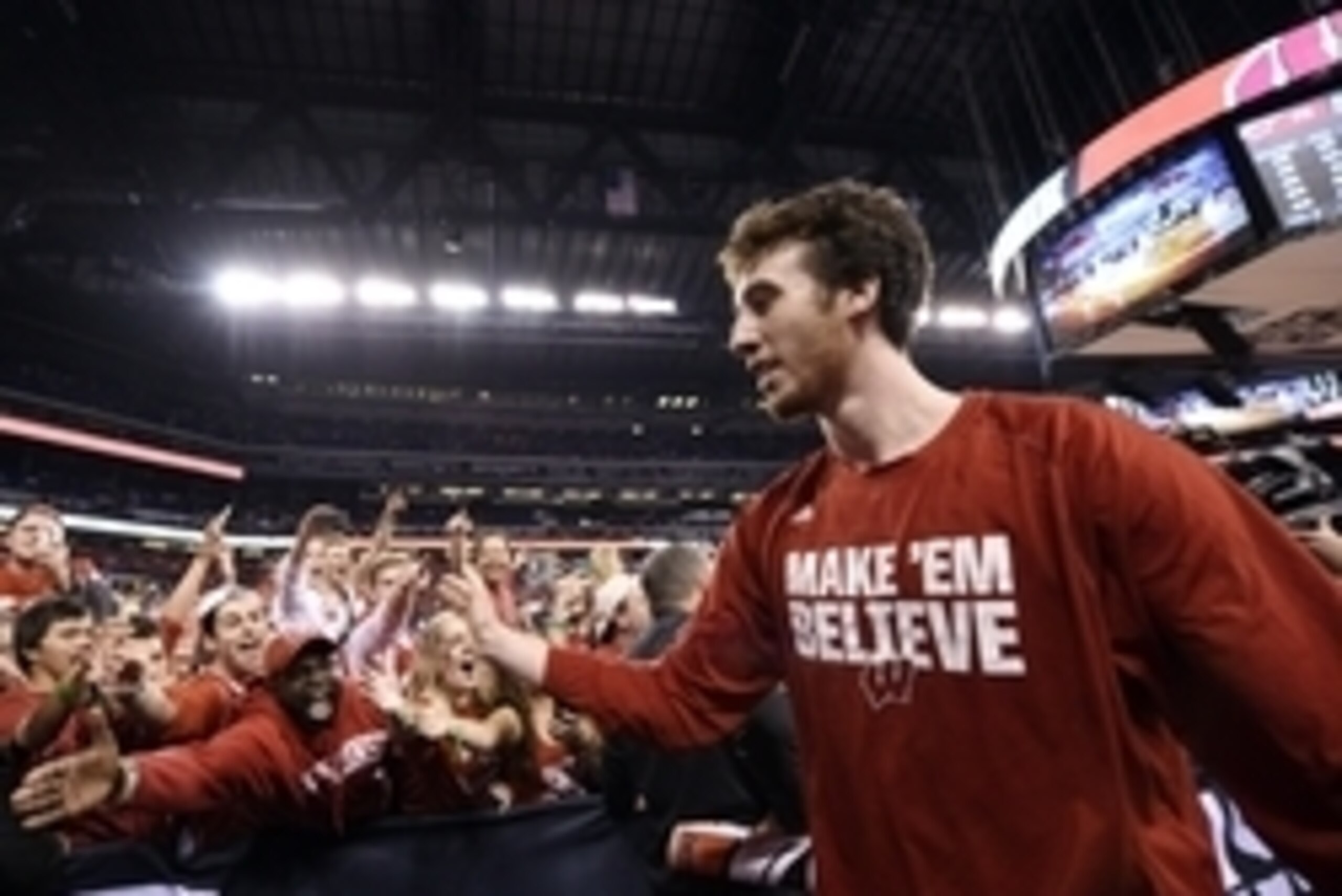 Apr 4, 2015; Indianapolis, IN, USA; Wisconsin Badgers forward Frank Kaminsky (44) celebrates with fans after defeating the Kentucky Wildcats in the 2015 NCAA Men's Division I Championship semi-final game at Lucas Oil Stadium. Mandatory Credit: Bob Donnan-