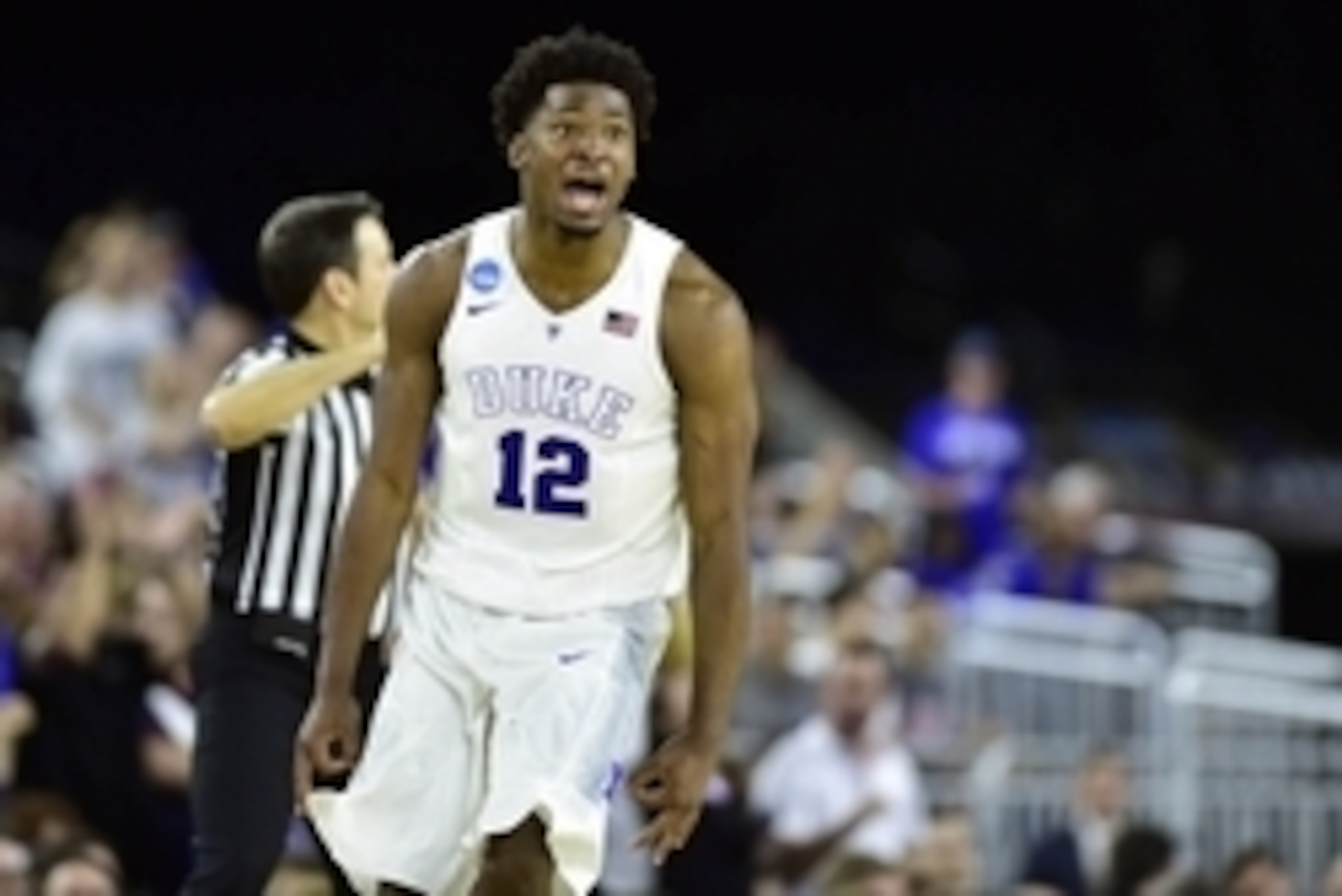 Mar 29, 2015; Houston, TX, USA; Duke Blue Devils forward Justise Winslow (12) celebrates after making a three-point basket against the Gonzaga Bulldogs during the second half in the finals of the south regional of the 2015 NCAA Tournament at NRG Stadium. 