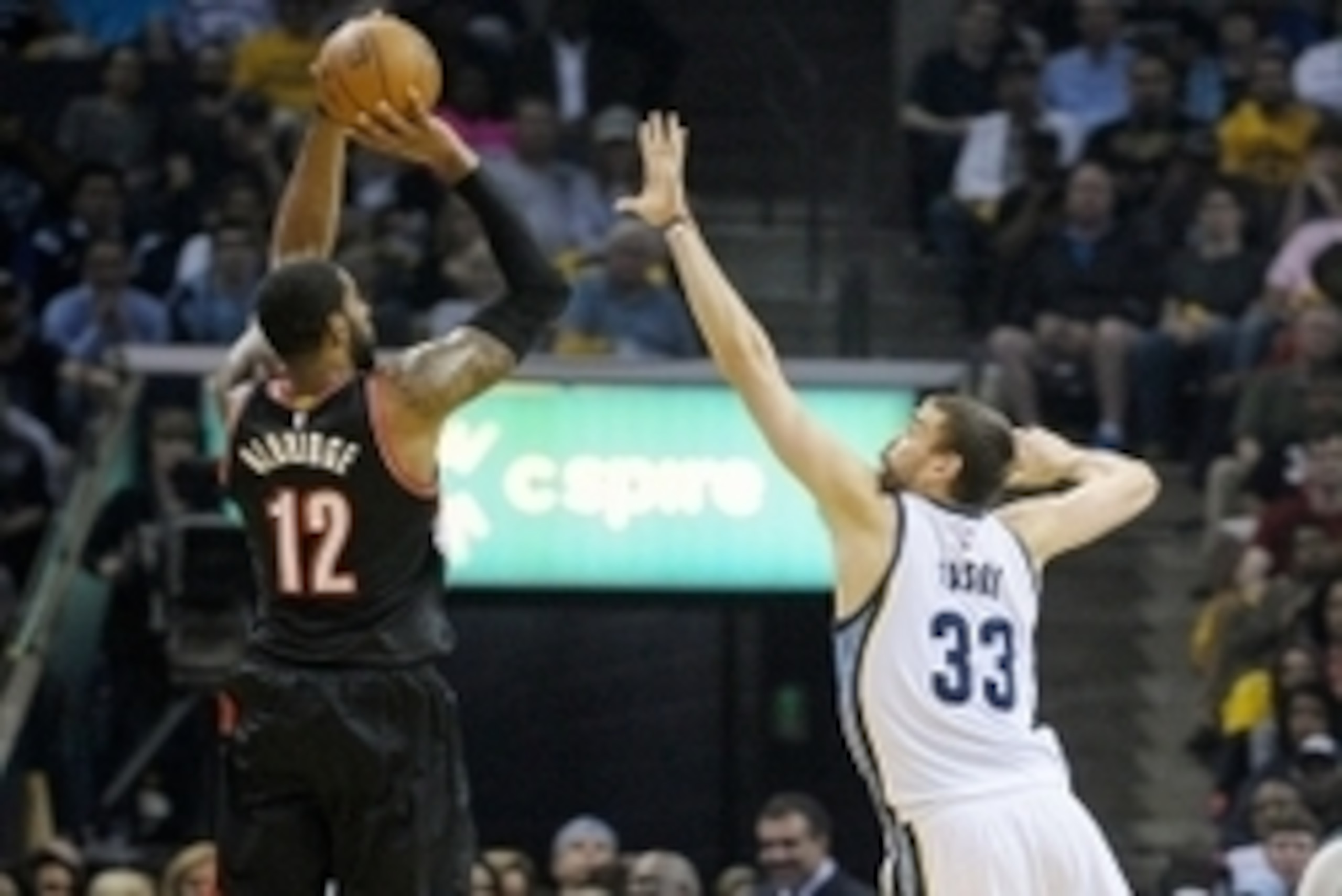 Apr 22, 2015; Memphis, TN, USA; Portland Trail Blazers forward LaMarcus Aldridge (12) shoots over Memphis Grizzlies center Marc Gasol (33) during game two of the first round of the NBA Playoffs at FedExForum. Mandatory Credit: Justin Ford-USA TODAY Sports