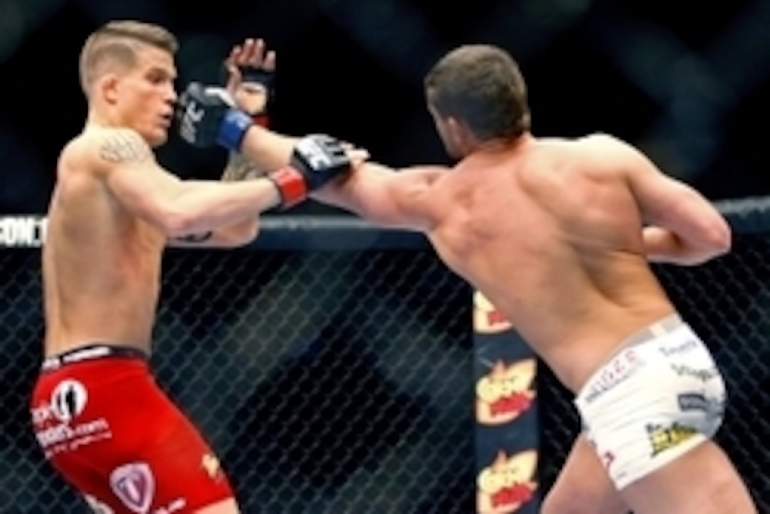 May 10, 2014; Cincinnati, OH, USA; Daron Cruickshank (blue gloves) fights Erik Koch (red gloves) during a lightweight bout at US Bank Arena. Mandatory Credit: Joe Maiorana-USA TODAY Sports