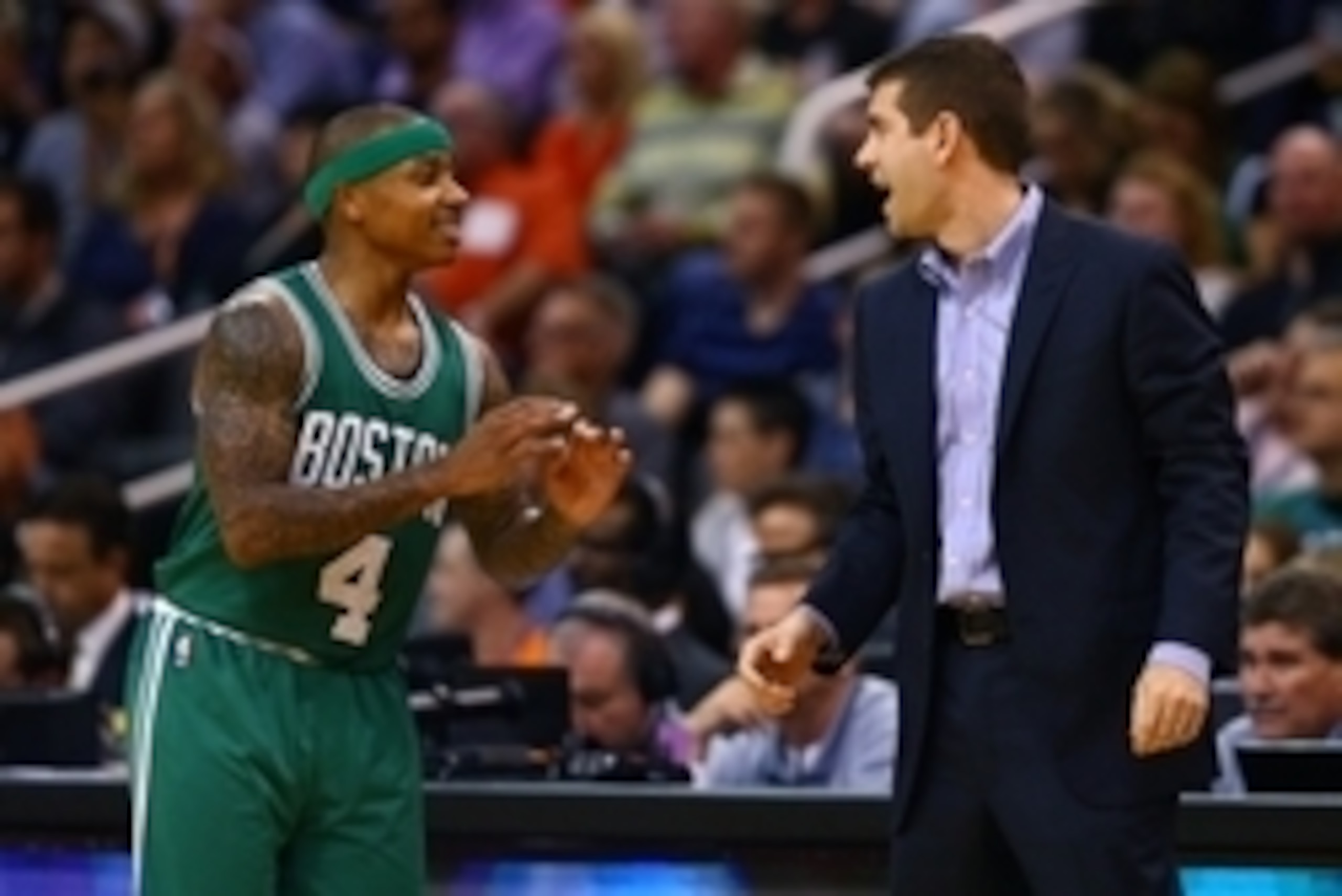 Feb 23, 2015; Phoenix, AZ, USA; Boston Celtics guard Isaiah Thomas (4) talks with head coach Brad Stevens in the second half against the Phoenix Suns at US Airways Center. The Celtics defeats the Suns 115-110. Mandatory Credit: Mark J. Rebilas-USA TODAY S