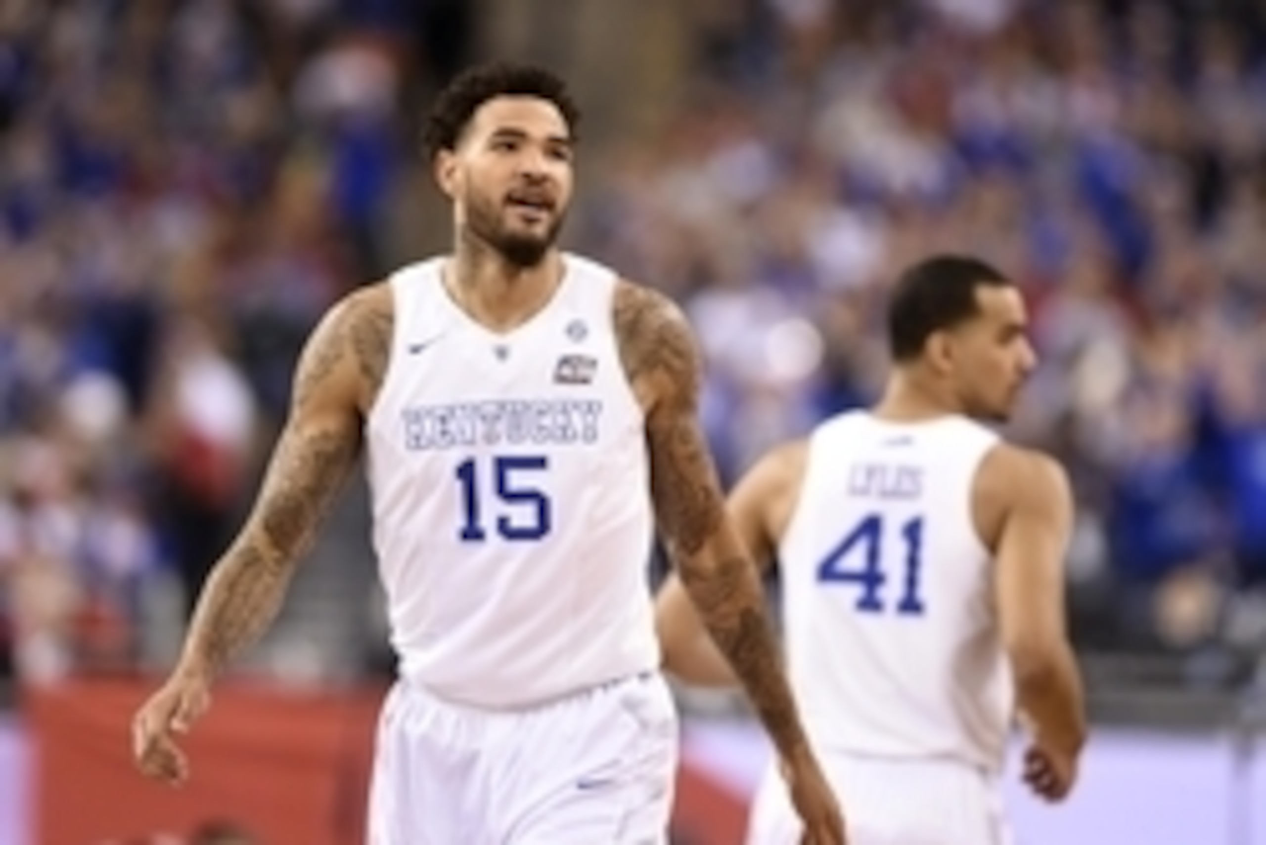 Apr 4, 2015; Indianapolis, IN, USA; Kentucky Wildcats forward Willie Cauley-Stein (15) reacts after a dunk against the Wisconsin Badgers in the first half of the 2015 NCAA Men's Division I Championship semi-final game at Lucas Oil Stadium. Mandatory Credi