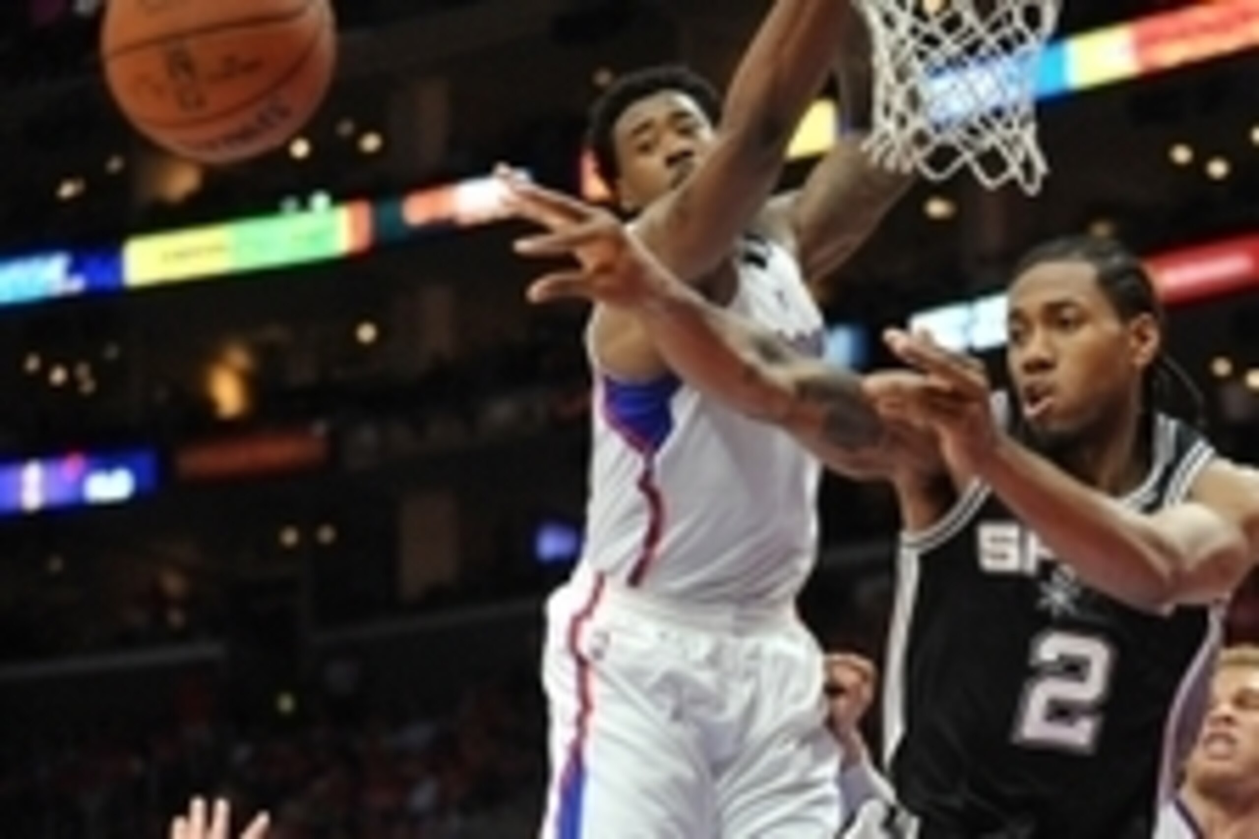 April 22, 2015; Los Angeles, CA, USA; San Antonio Spurs forward Kawhi Leonard (2) passes the ball against the defense of Los Angeles Clippers center DeAndre Jordan (6) during the second half in game two of the first round of the NBA Playoffs. at Staples C
