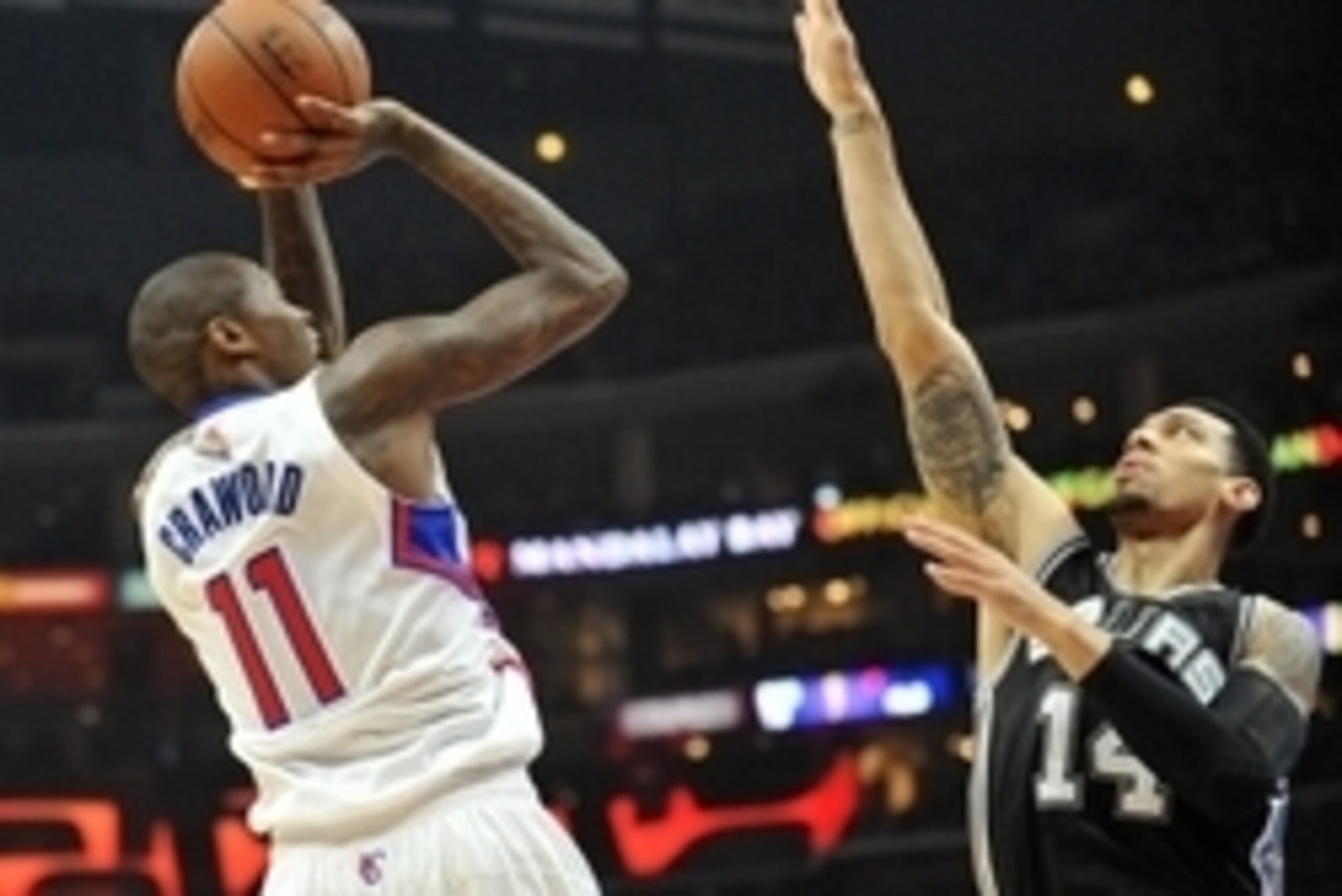 April 22, 2015; Los Angeles, CA, USA; Los Angeles Clippers guard Jamal Crawford (11) shoots against the defense of San Antonio Spurs guard Danny Green (14) during the first half in game two of the first round of the NBA Playoffs. at Staples Center. Mandat