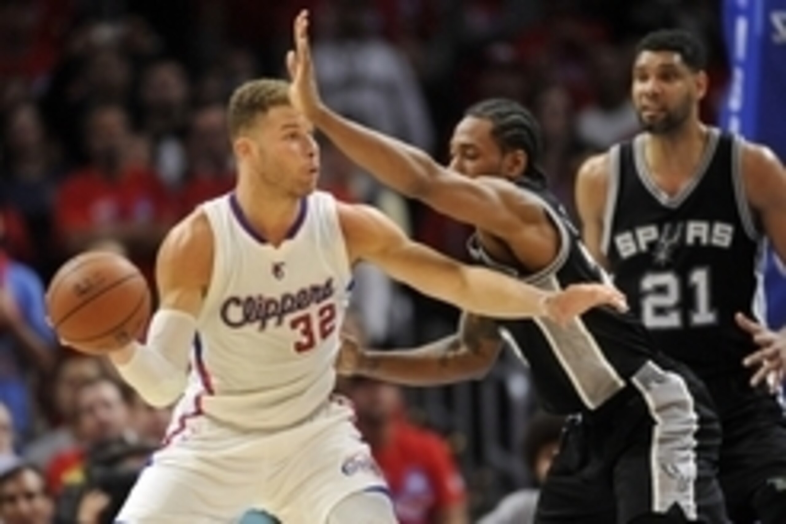April 22, 2015; Los Angeles, CA, USA; Los Angeles Clippers forward Blake Griffin (32) controls the ball against the defense of San Antonio Spurs forward Kawhi Leonard (2) during the second half in game two of the first round of the NBA Playoffs. at Staple