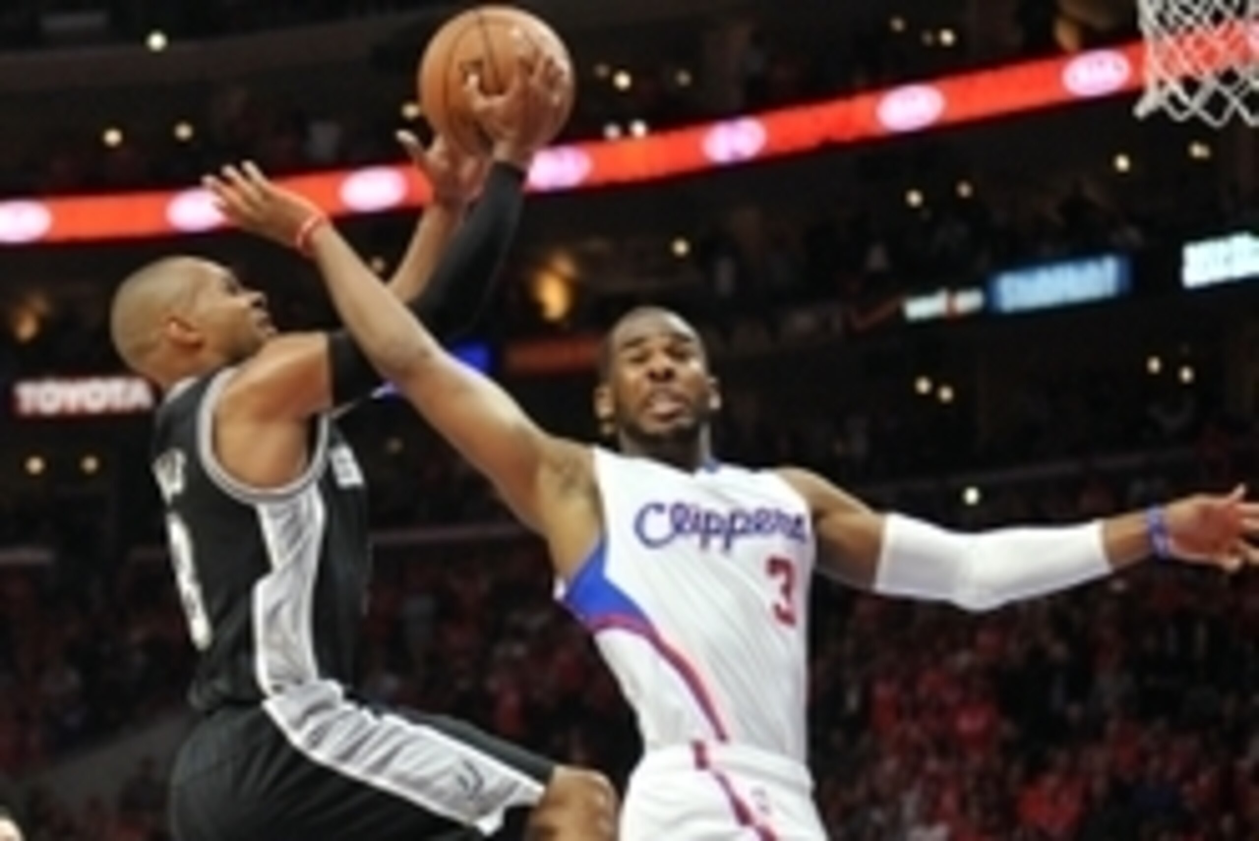 April 22, 2015; Los Angeles, CA, USA; San Antonio Spurs guard Patty Mills (8) moves to the basket but is fouled by Los Angeles Clippers guard Chris Paul (3) during the second half in game two of the first round of the NBA Playoffs. at Staples Center. Mand