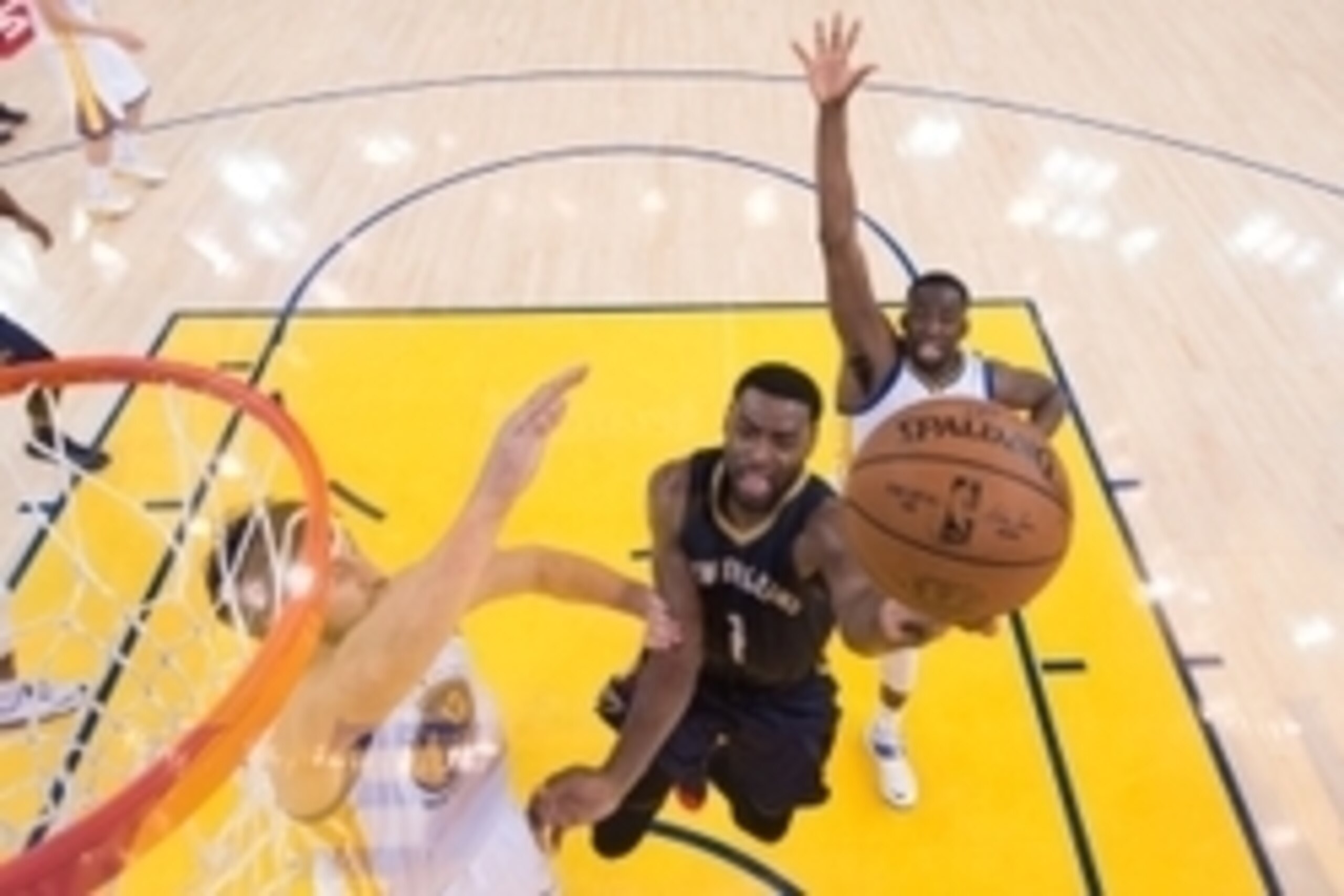 April 20, 2015; Oakland, CA, USA; New Orleans Pelicans guard Tyreke Evans (1) shoots a layup against Golden State Warriors center Andrew Bogut (12) and forward Draymond Green (23, right) during the second half in game two of the first round of the NBA Pla