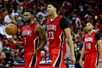 Apr 15, 2015; New Orleans, LA, USA; New Orleans Pelicans forward Anthony Davis (23) celebrates with guard Tyreke Evans (1) during a game against the San Antonio Spurs at the Smoothie King Center. The Pelicans defeated the Spurs 108-103 and earned the 8th 