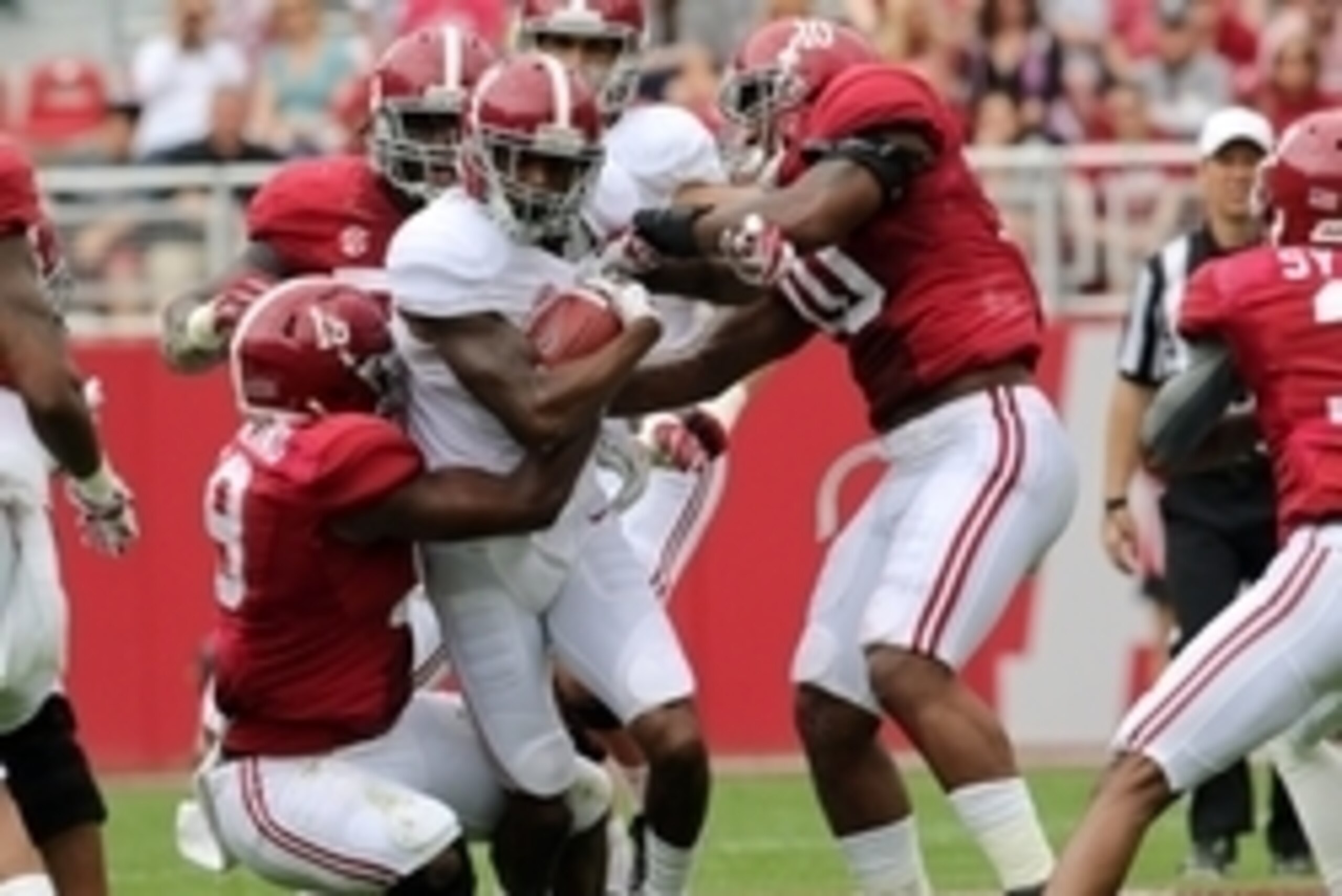 Apr 18, 2015; Tuscaloosa, AL, USA; Alabama Crimson Tide wide receiver Robert Foster (8) of the white team is tackled by Alabama Crimson Tide linebacker Reggie Ragland (19) and linebacker Reuben Foster (10) of the crimson team during the annual A-day game 