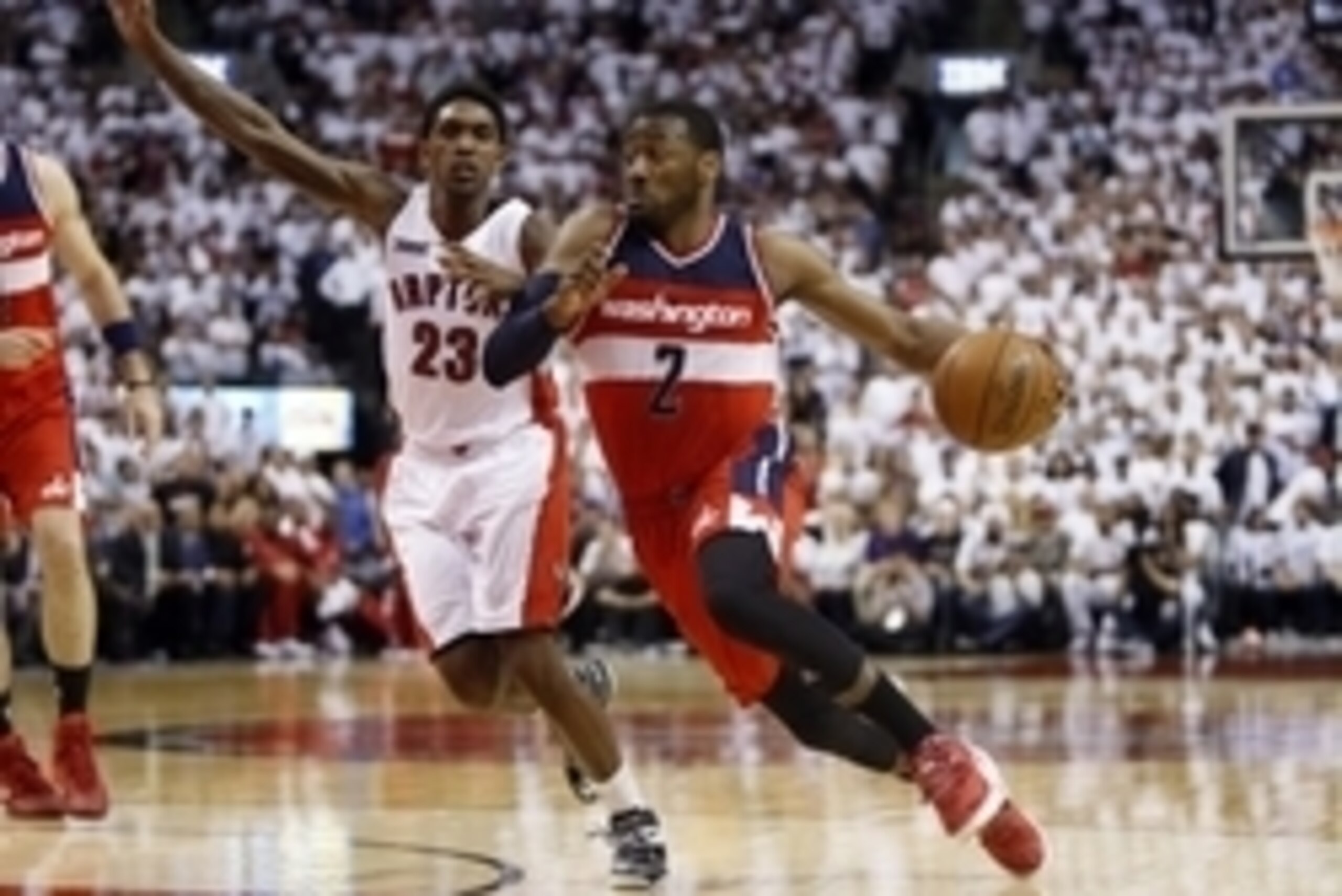 Apr 18, 2015; Toronto, Ontario, CAN; Washington Wizards guard John Wall (2) drives to the net past Toronto Raptors guard Louis Williams (23) in game one of the first round of the NBA Playoffs at Air Canada Centre. Washington defeated Toronto 93-86. Mandat