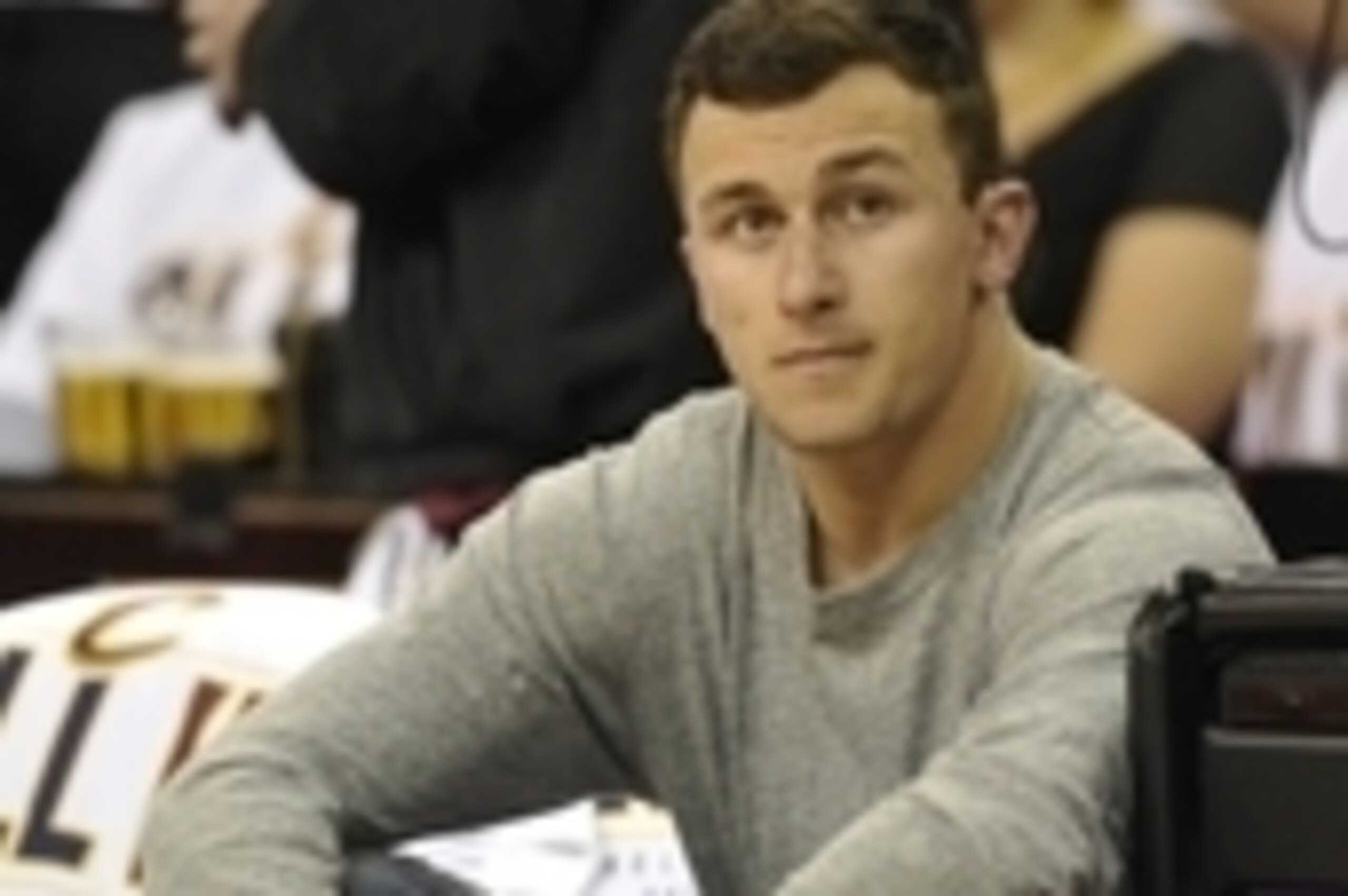 Apr 19, 2015; Cleveland, OH, USA; Cleveland Browns quarterback Johnny Manziel sits in the front row prior to game one of the first round of the NBA Playoffs at Quicken Loans Arena. Mandatory Credit: David Richard-USA TODAY Sports Apr 19, 2015; Cleveland, OH, USA; Cleveland Browns quarterback Johnny Manziel sits in the front row prior to game one of the first round of the NBA Playoffs at Quicken Loans Arena. Mandatory Credit: David Richard-USA TODAY Sports