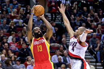 Mar 11, 2015; Portland, OR, USA; Houston Rockets guard James Harden (13) shoots over Portland Trail Blazers guard Arron Afflalo (4) during the third quarter at the Moda Center. Mandatory Credit: Craig Mitchelldyer-USA TODAY Sports