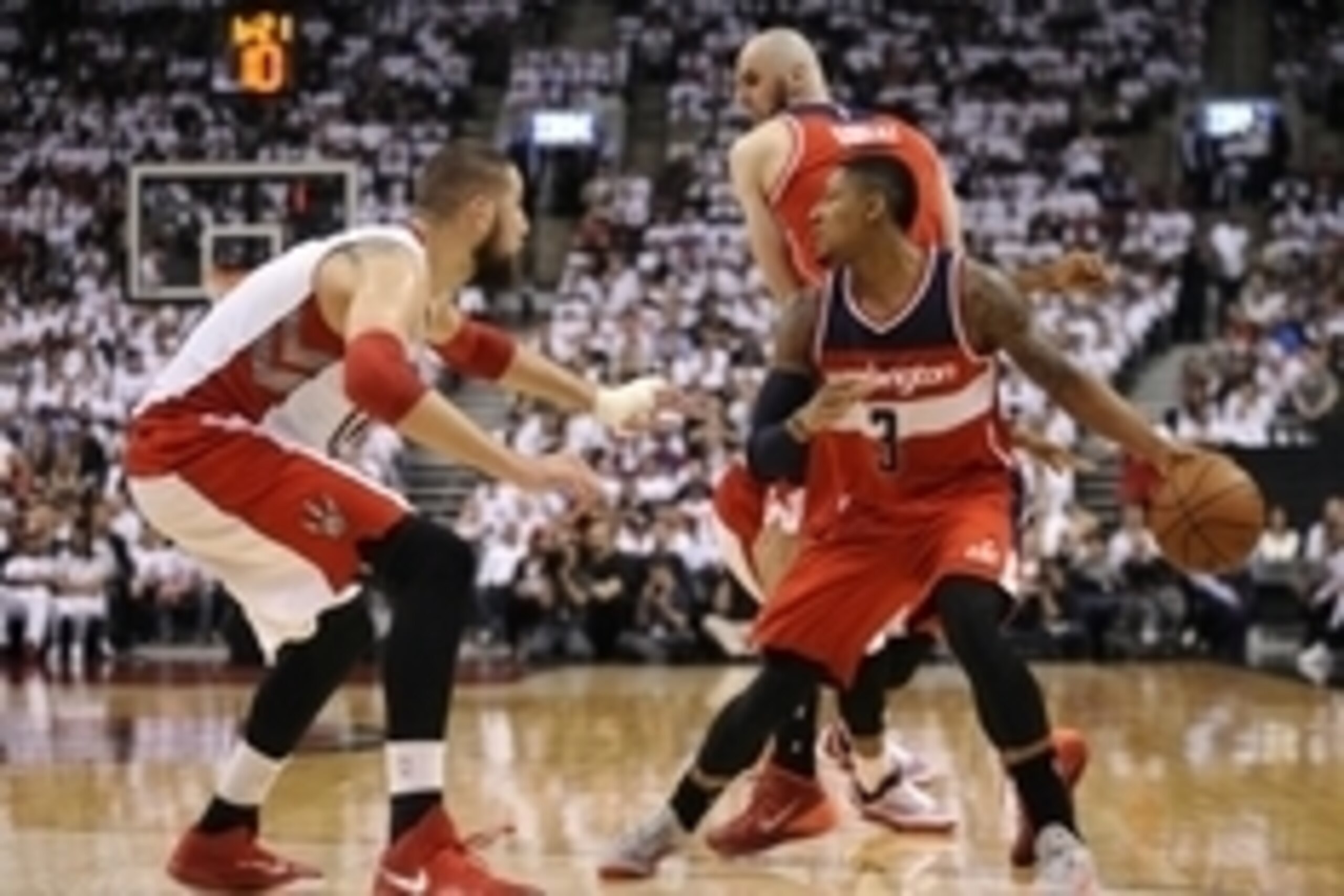 Apr 21, 2015; Toronto, Ontario, CAN; Washington Wizards guard Bradley Beal (3) looks to pass as Toronto Raptors center Jonas Valanciunas (17) defends in the fourth quarter in game two of the first round of the NBA Playoffs at Air Canada Centre. Wizards be