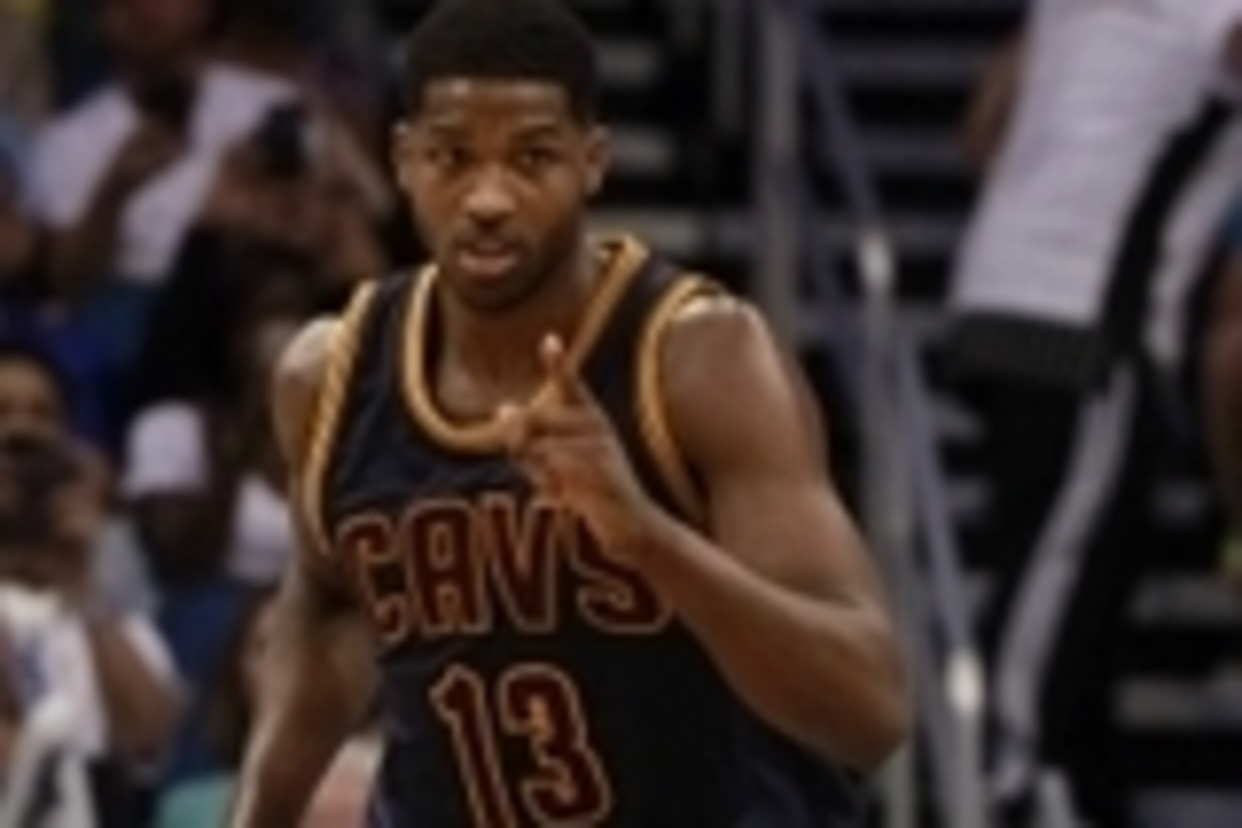 Mar 15, 2015; Orlando, FL, USA; Cleveland Cavaliers center Tristan Thompson (13) points after he made a basket against the Orlando Magic during the second half at Amway Center. Cleveland Cavaliers defeated the Orlando Magic 123-108. Mandatory Credit: Kim 