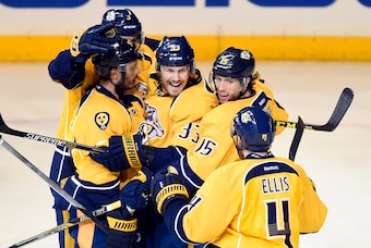 Apr 23, 2015; Nashville, TN, USA; Nashville Predators center Colin Wilson (33) celebrates with teammates after a goal during the third period against the Chicago Blackhawks in game five of the first round of the 2015 Stanley Cup Playoffs at Bridgestone Ar
