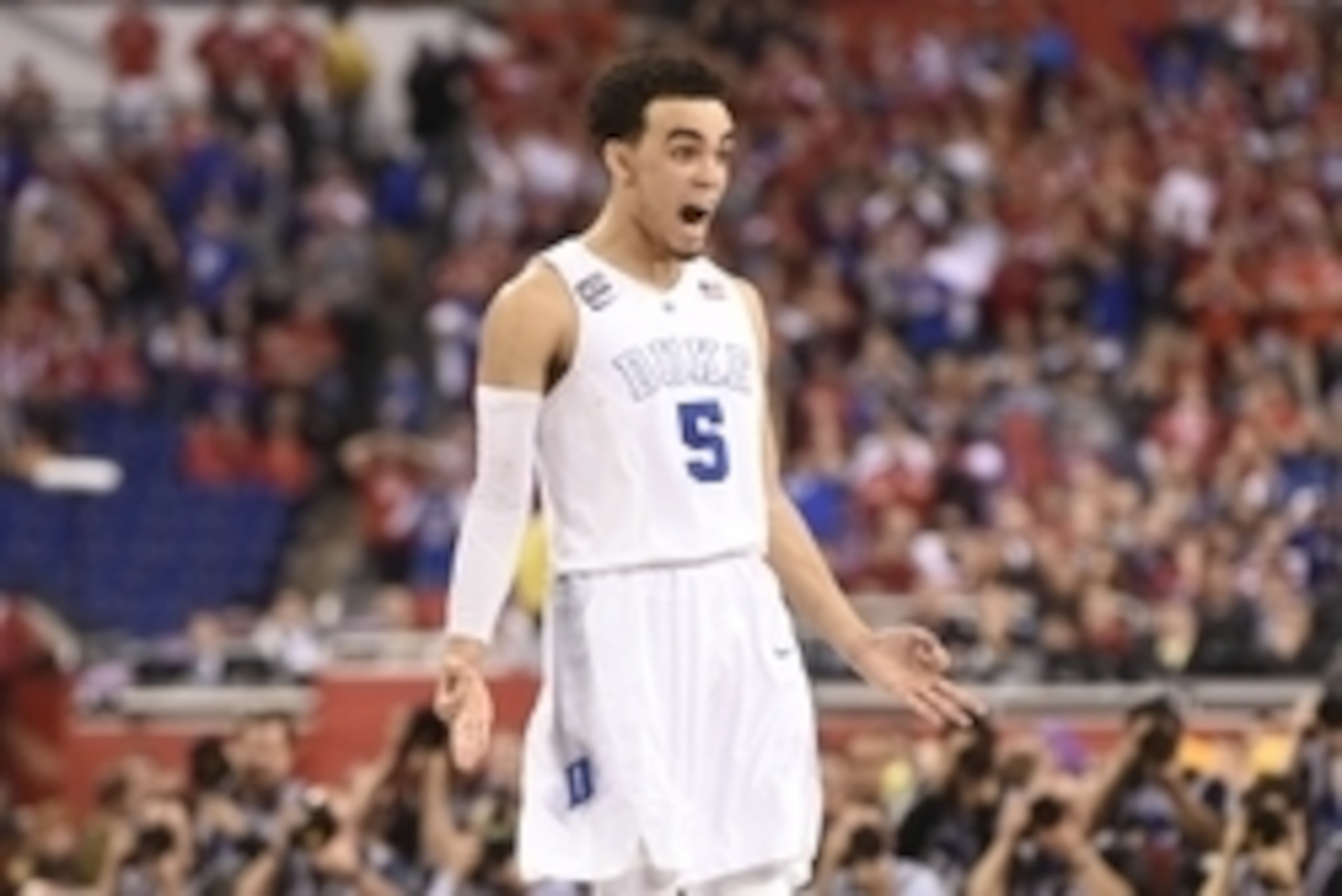 Apr 6, 2015; Indianapolis, IN, USA; Duke Blue Devils guard Tyus Jones (5) reacts after hitting a three-point shot against the Wisconsin Badgers during the second half in the 2015 NCAA Men's Division I Championship game at Lucas Oil Stadium. Mandatory Cred Apr 6, 2015; Indianapolis, IN, USA; Duke Blue Devils guard Tyus Jones (5) reacts after hitting a three-point shot against the Wisconsin Badgers during the second half in the 2015 NCAA Men's Division I Championship game at Lucas Oil Stadium. Mandatory Cred