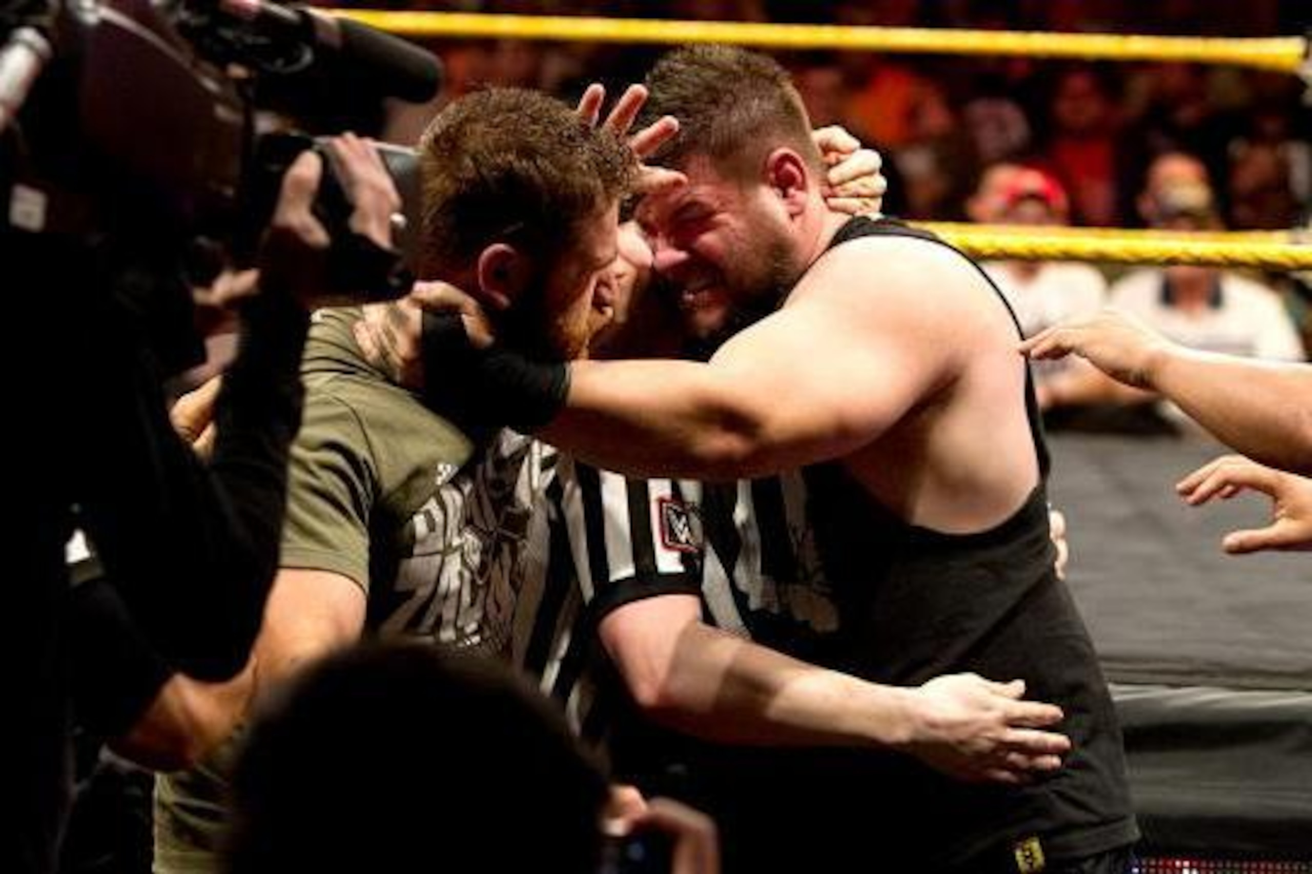 Sami Zayn and Kevin Owens brawl.