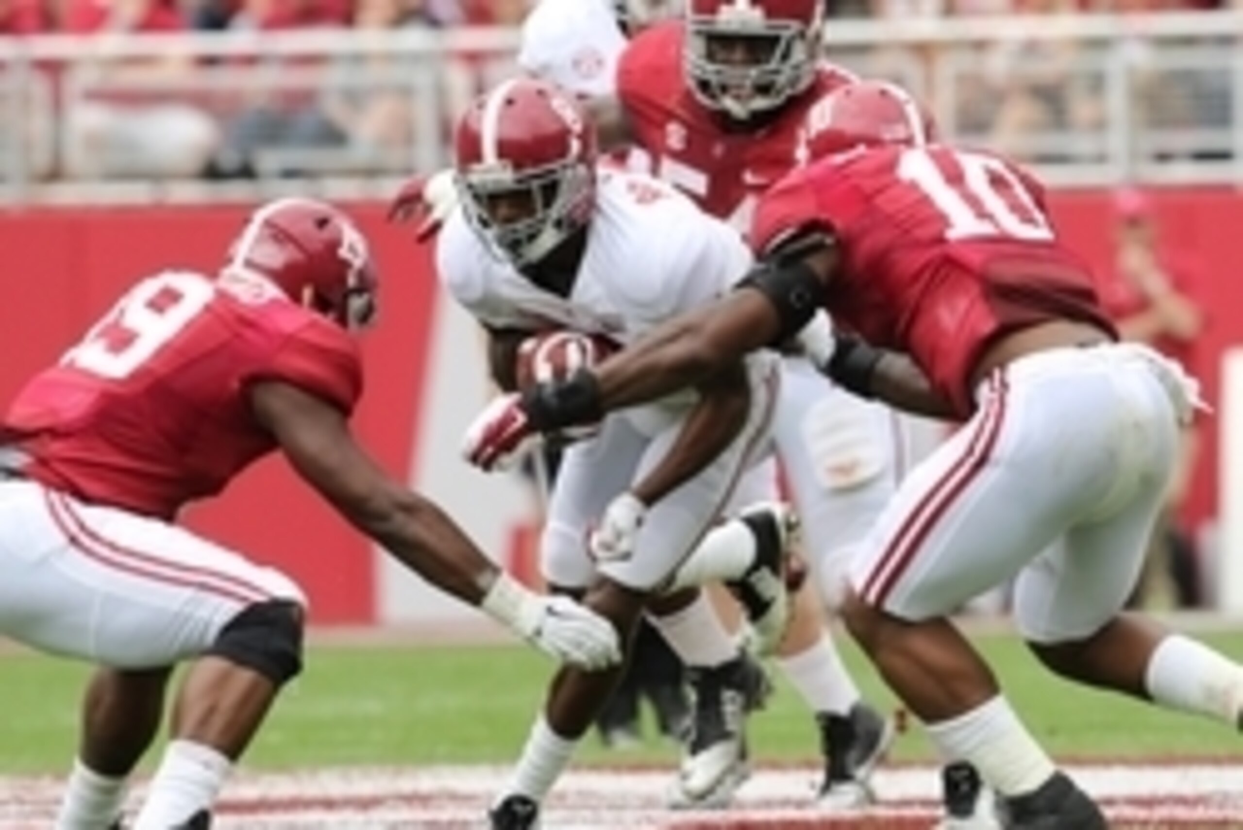Apr 18, 2015; Tuscaloosa, AL, USA; Alabama Crimson Tide wide receiver Robert Foster (8) is grabbed by Alabama Crimson Tide linebacker Reuben Foster (10) and  linebacker Reggie Ragland (19) during the A-day game at Bryant Denny Stadium. Mandatory Credit: M