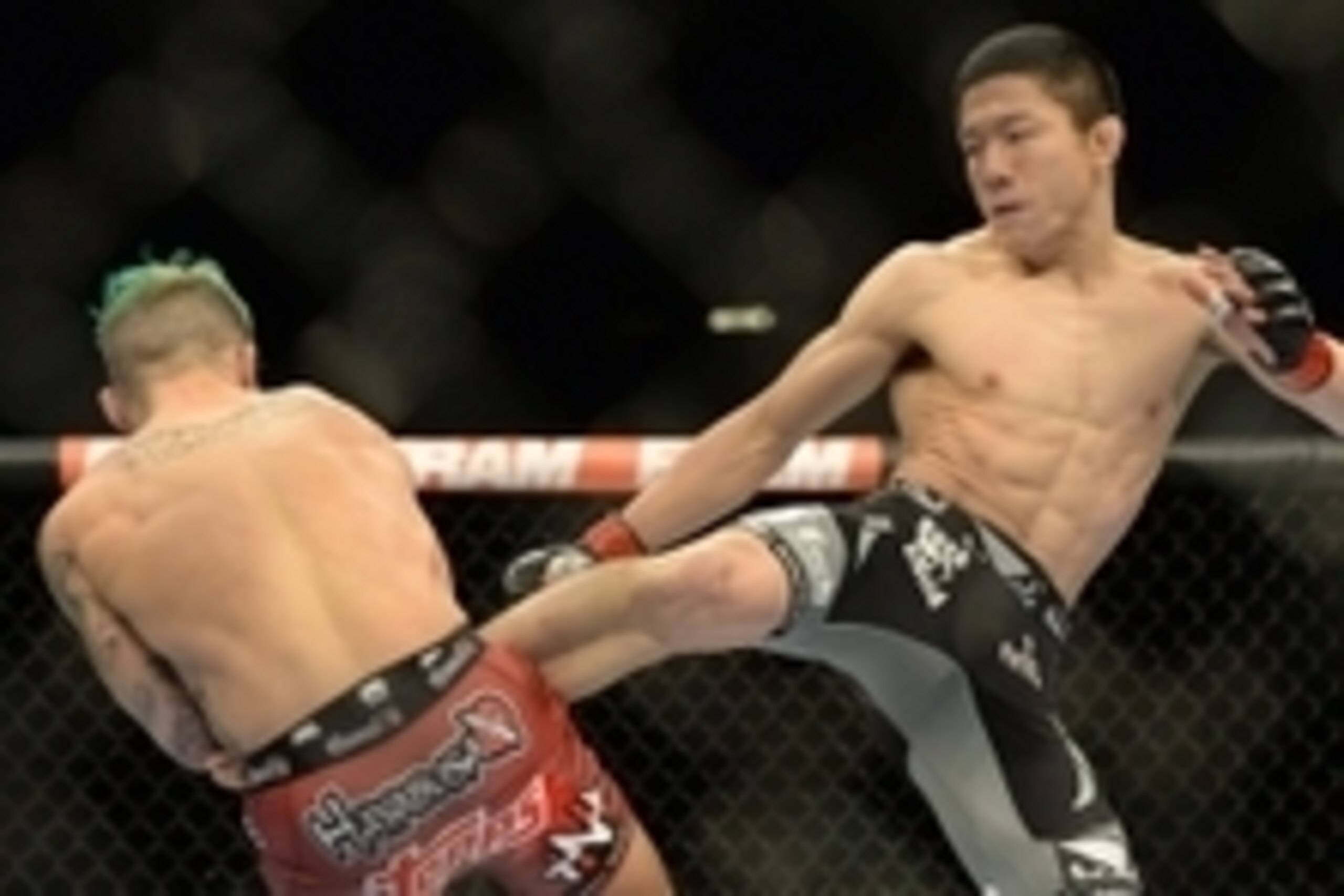 Jan 3, 2015; Las Vegas, NV, USA; Kyoji Horiguchi (red gloves) and Louis Gaudinot (blue gloves) compete in their flyweight bout at UFC 182 at MGM Grand Garden Arena. Mandatory Credit: Jayne Kamin-Oncea-USA TODAY Sports