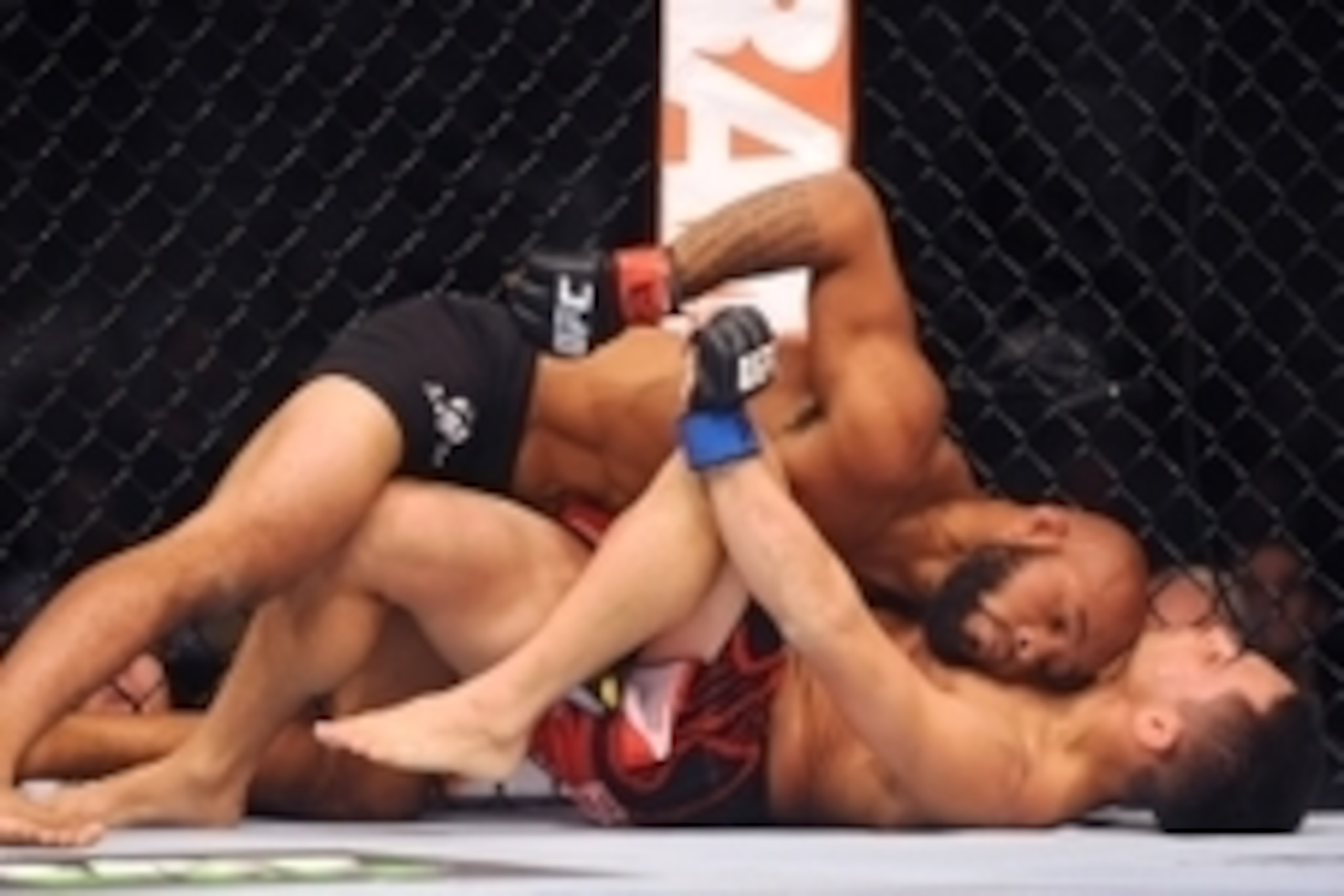 Sep 27, 2014; Las Vegas, NV, USA; Demetrious Johnson (red gloves) fights Chris Cariaso (blue gloves) during a featherweight title bout on the UFC 178 card at MGM Grand Garden Arena. Mandatory Credit: Stephen R. Sylvanie-USA TODAY Sports