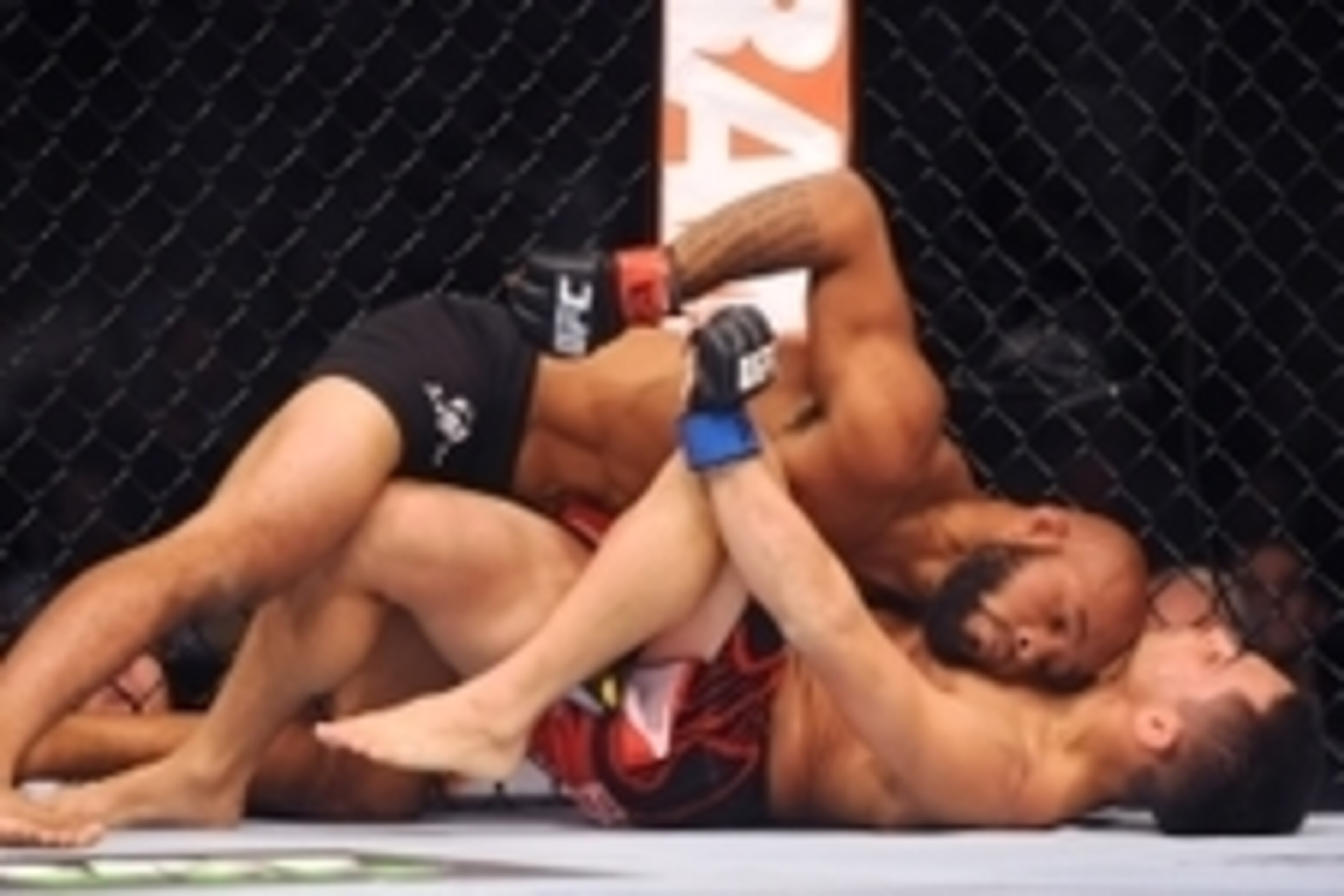 Sep 27, 2014; Las Vegas, NV, USA; Demetrious Johnson (red gloves) fights Chris Cariaso (blue gloves) during a featherweight title bout on the UFC 178 card at MGM Grand Garden Arena. Mandatory Credit: Stephen R. Sylvanie-USA TODAY Sports