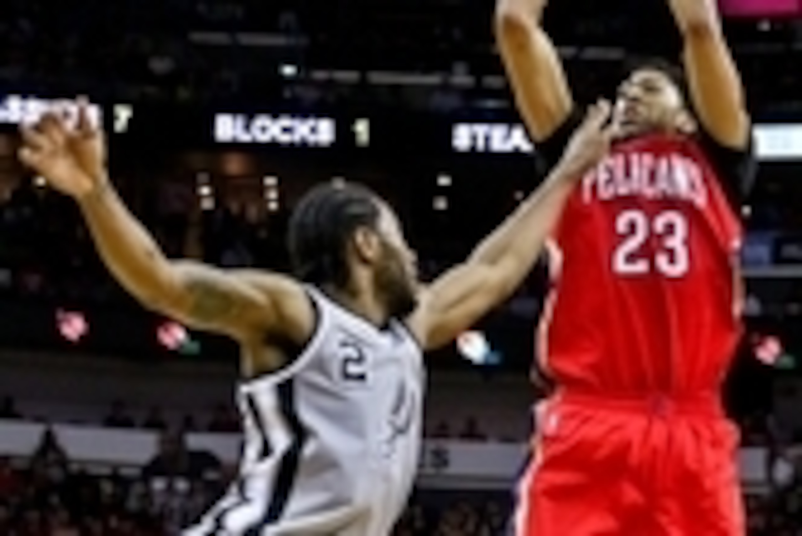 Apr 15, 2015; New Orleans, LA, USA; New Orleans Pelicans forward Anthony Davis (23) shoots over San Antonio Spurs forward Kawhi Leonard (2) during a game at the Smoothie King Center. The Pelicans defeated the Spurs 108-103 and earned the 8th seed in the W