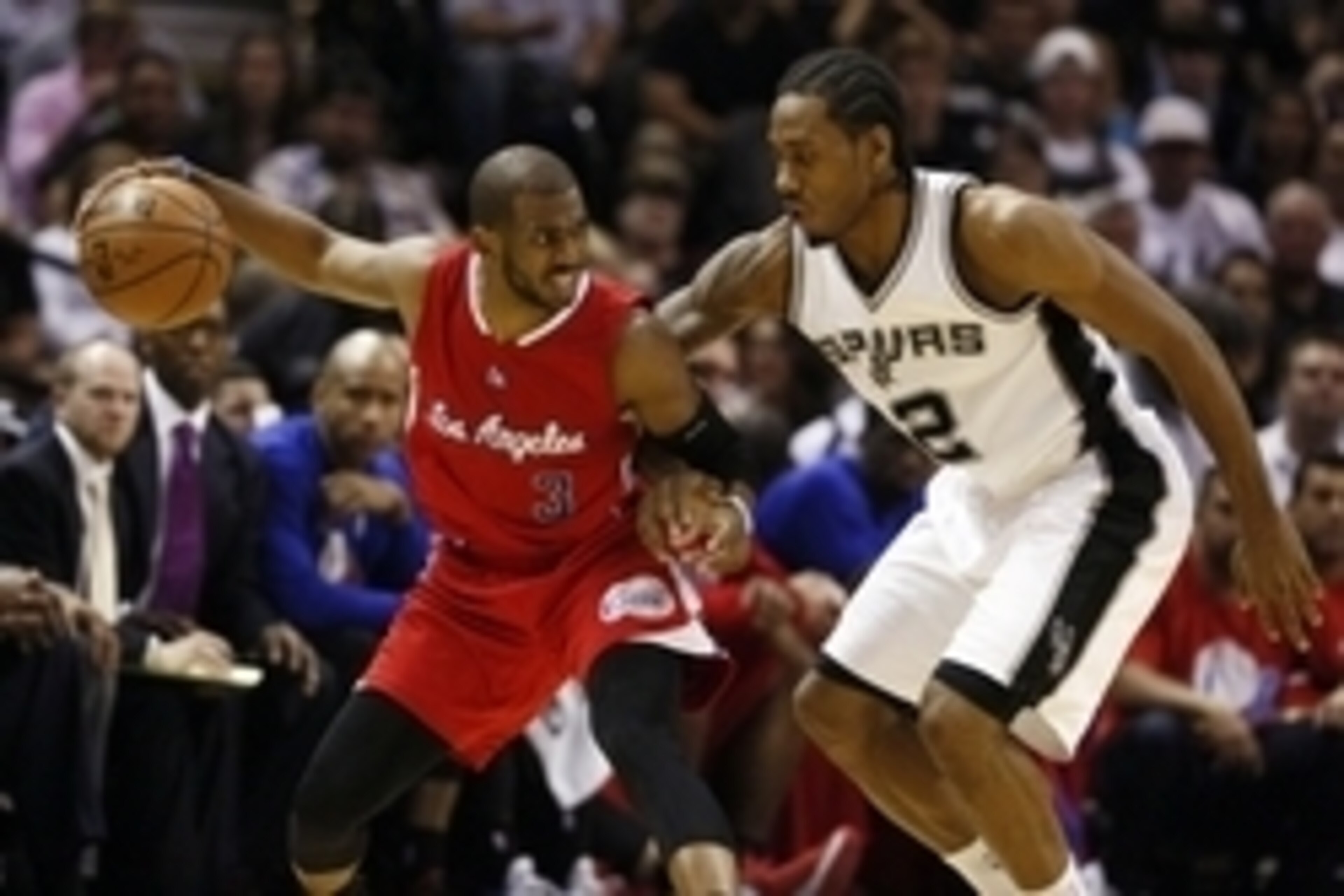 Apr 24, 2015; San Antonio, TX, USA; Los Angeles Clippers point guard Chris Paul (3) dribbles against San Antonio Spurs small forward Kawhi Leonard (2) in game three of the first round of the NBA Playoffs at AT&T Center. Mandatory Credit: Soobum Im-USA TOD
