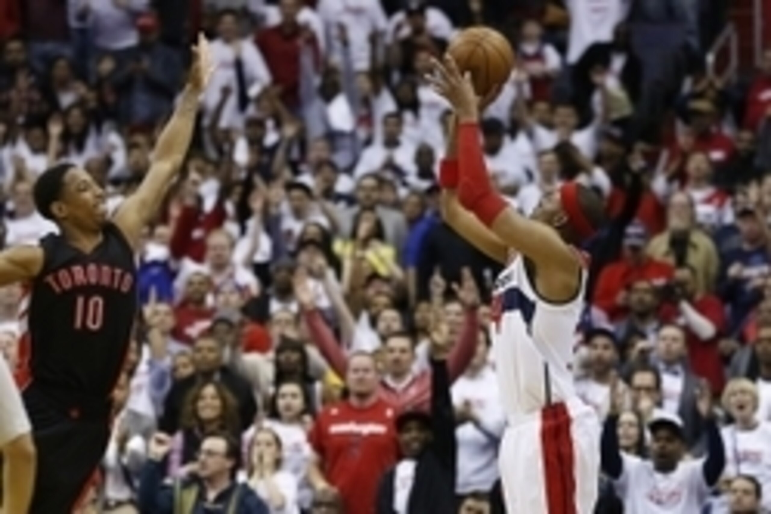 Apr 24, 2015; Washington, DC, USA; Washington Wizards forward Paul Pierce (34) shoots the ball over Toronto Raptors guard DeMar DeRozan (10) in the fourth quarter in game three of the first round of the NBA Playoffs at Verizon Center. The Wizards won 106-