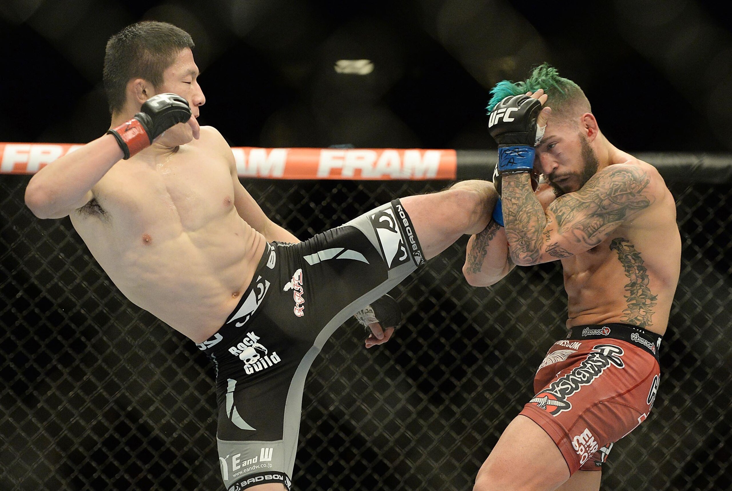 Jan 3, 2015; Las Vegas, NV, USA; Kyoji Horiguchi (red gloves) and Louis Gaudinot (blue gloves) in their flyweight bout at UFC 182 at MGM Grand Garden Arena. Horiguchi won. Mandatory Credit: Jayne Kamin-Oncea-USA TODAY Sports