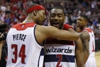 Apr 24, 2015; Washington, DC, USA; Washington Wizards forward Paul Pierce (34) and Wizards guard John Wall (2) celebrate after their game against the Toronto Raptors in game three of the first round of the NBA Playoffs at Verizon Center. The Wizards won 1