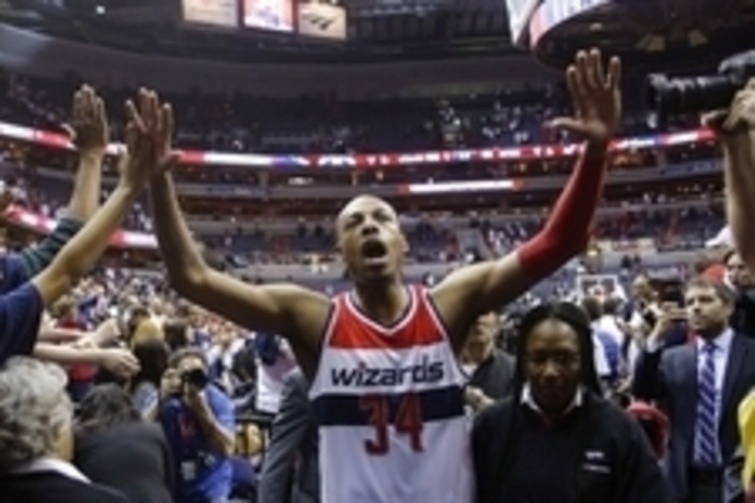 Apr 24, 2015; Washington, DC, USA; Washington Wizards forward Paul Pierce (34) celebrates with fans while leaving the court after the Wizards' game against the Toronto Raptors in game three of the first round of the NBA Playoffs at Verizon Center. The Wiz