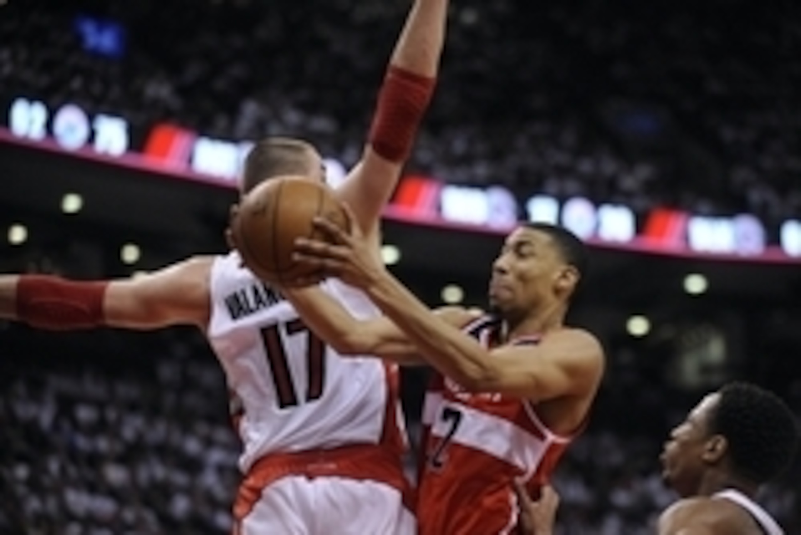 Apr 21, 2015; Toronto, Ontario, CAN; Washington Wizards forward Otto Porter (22) drives to the basket as Toronto Raptorscenter Jonas Valanciunas (17) attempts to block in the third quarter  in game two of the first round of the NBA Playoffs at Air Canada 