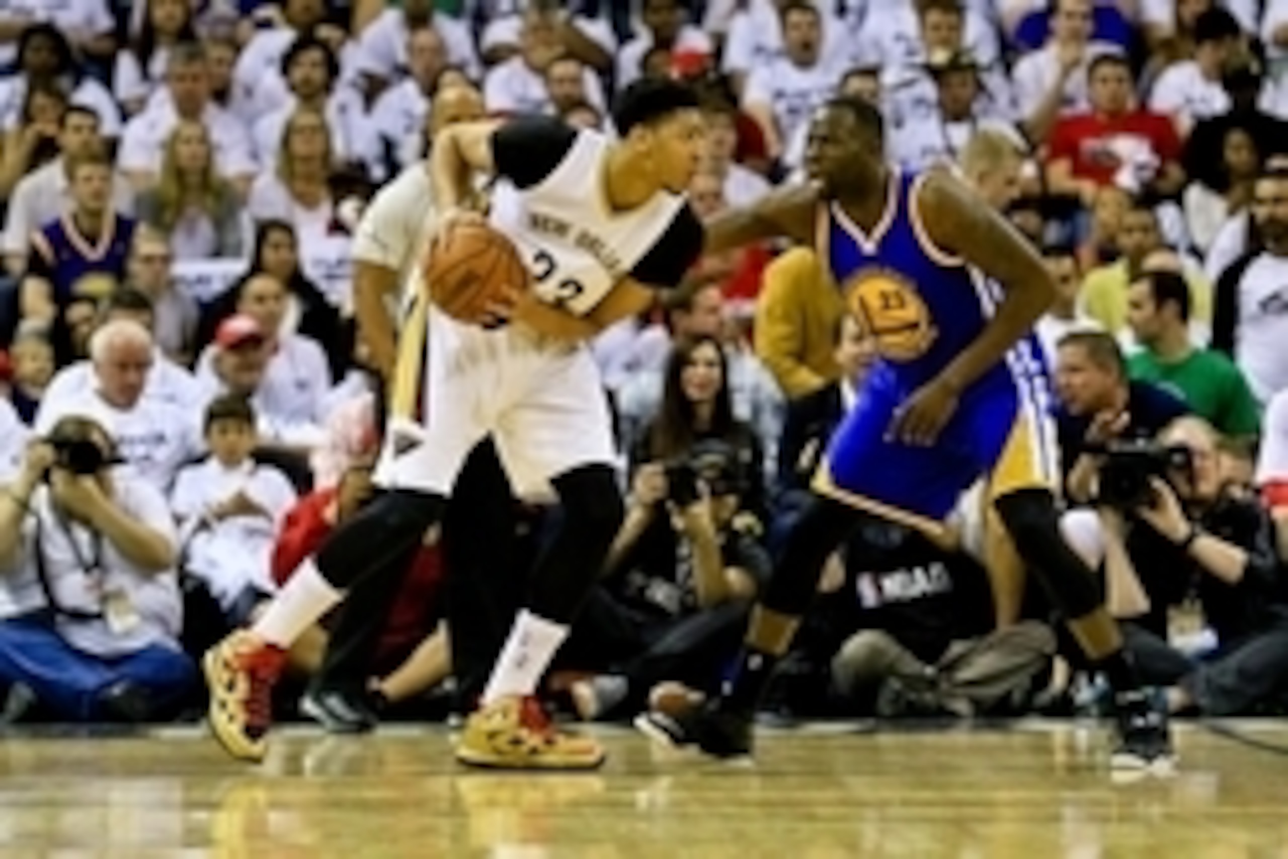 Apr 25, 2015; New Orleans, LA, USA; New Orleans Pelicans forward Anthony Davis (23) is defended by Golden State Warriors forward Draymond Green (23) during the first quarter in game four of the first round of the NBA Playoffs at the Smoothie King Center. 