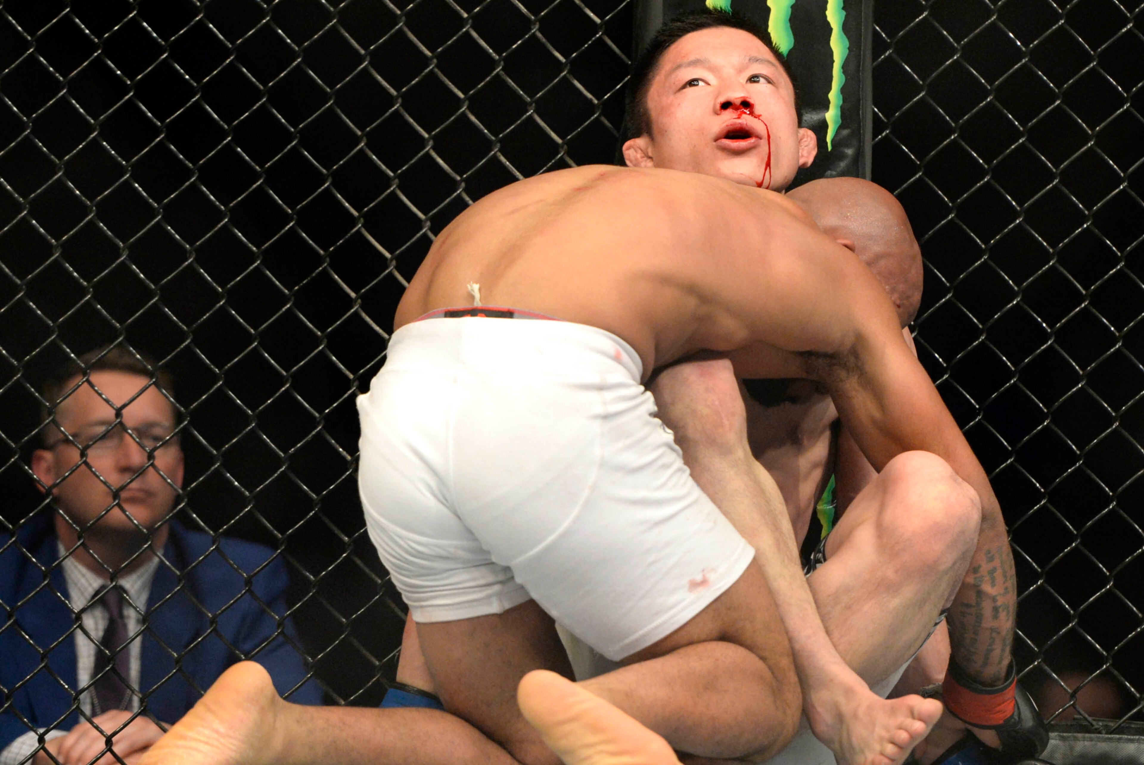 Apr 25, 2015; Montreal, Quebec, CAN; Demetrious Johnson (red) and Kyoji Horiguchi (blue) fight during their flyweight bout during UFC 186 at Bell Centre. Mandatory Credit: Eric Bolte-USA TODAY Sports Apr 25, 2015; Montreal, Quebec, CAN; Demetrious Johnson (red) and Kyoji Horiguchi (blue) fight during their flyweight bout during UFC 186 at Bell Centre. Mandatory Credit: Eric Bolte-USA TODAY Sports
