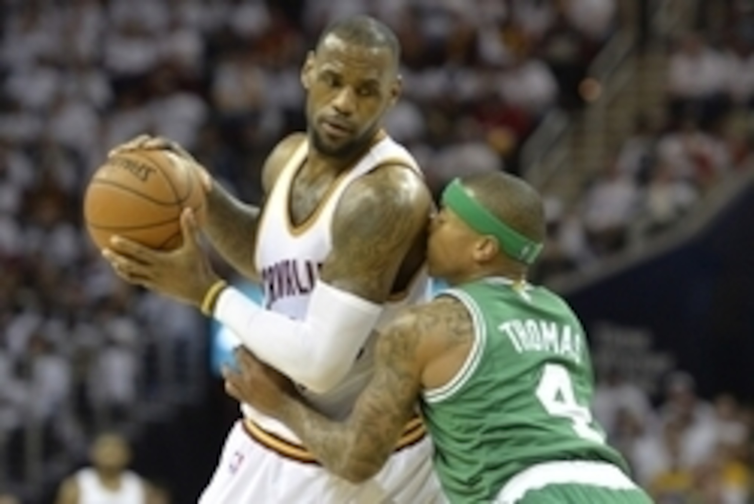 Apr 21, 2015; Cleveland, OH, USA; Boston Celtics guard Isaiah Thomas (4) defends Cleveland Cavaliers forward LeBron James (23) in the second quarter in game two of the first round of the NBA Playoffs at Quicken Loans Arena. Mandatory Credit: David Richard