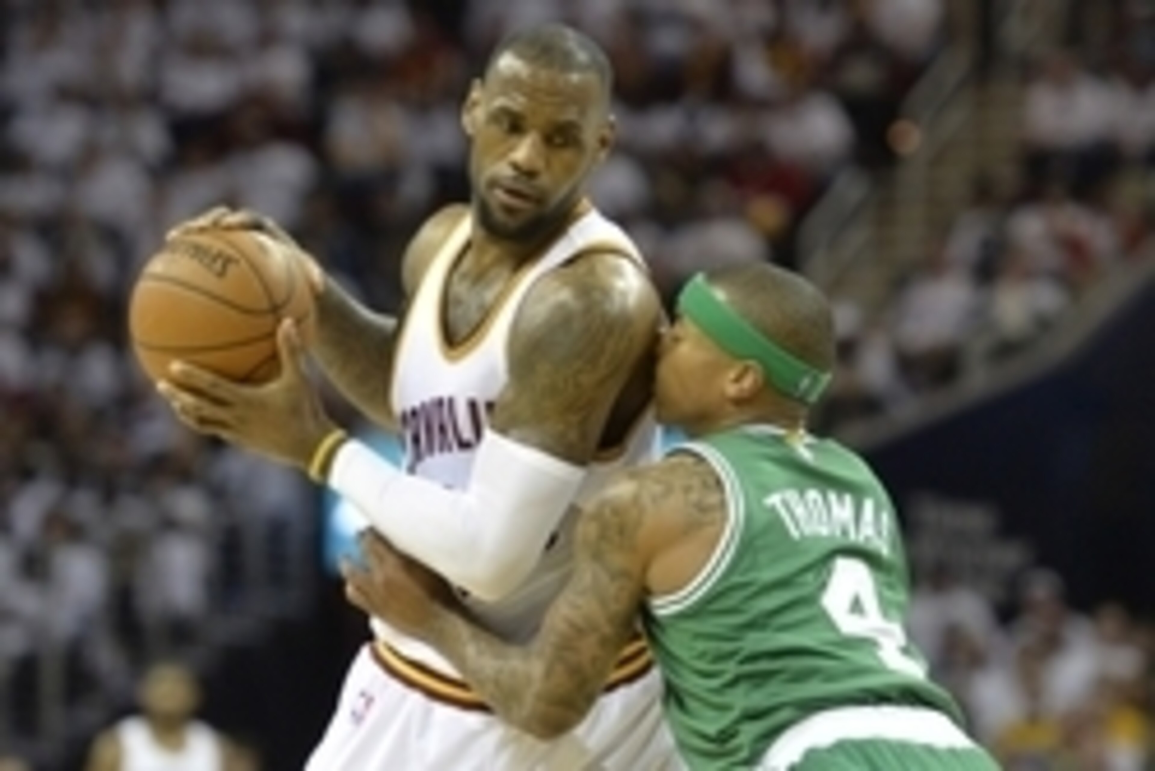 Apr 21, 2015; Cleveland, OH, USA; Boston Celtics guard Isaiah Thomas (4) defends Cleveland Cavaliers forward LeBron James (23) in the second quarter in game two of the first round of the NBA Playoffs at Quicken Loans Arena. Mandatory Credit: David Richard
