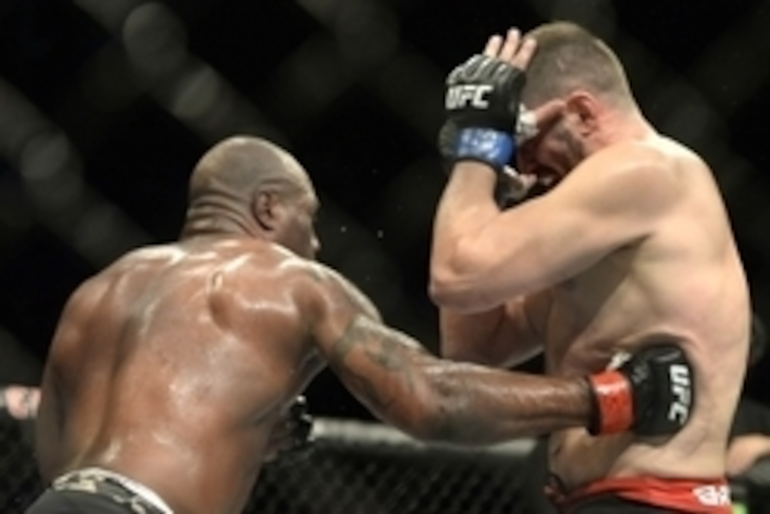 Apr 25, 2015; Montreal, Quebec, CAN; Rampage Jackson (red) and Fabio Maldonado (blue) fight during their catchweight bout during UFC 186 at Bell Centre. Mandatory Credit: Eric Bolte-USA TODAY Sports