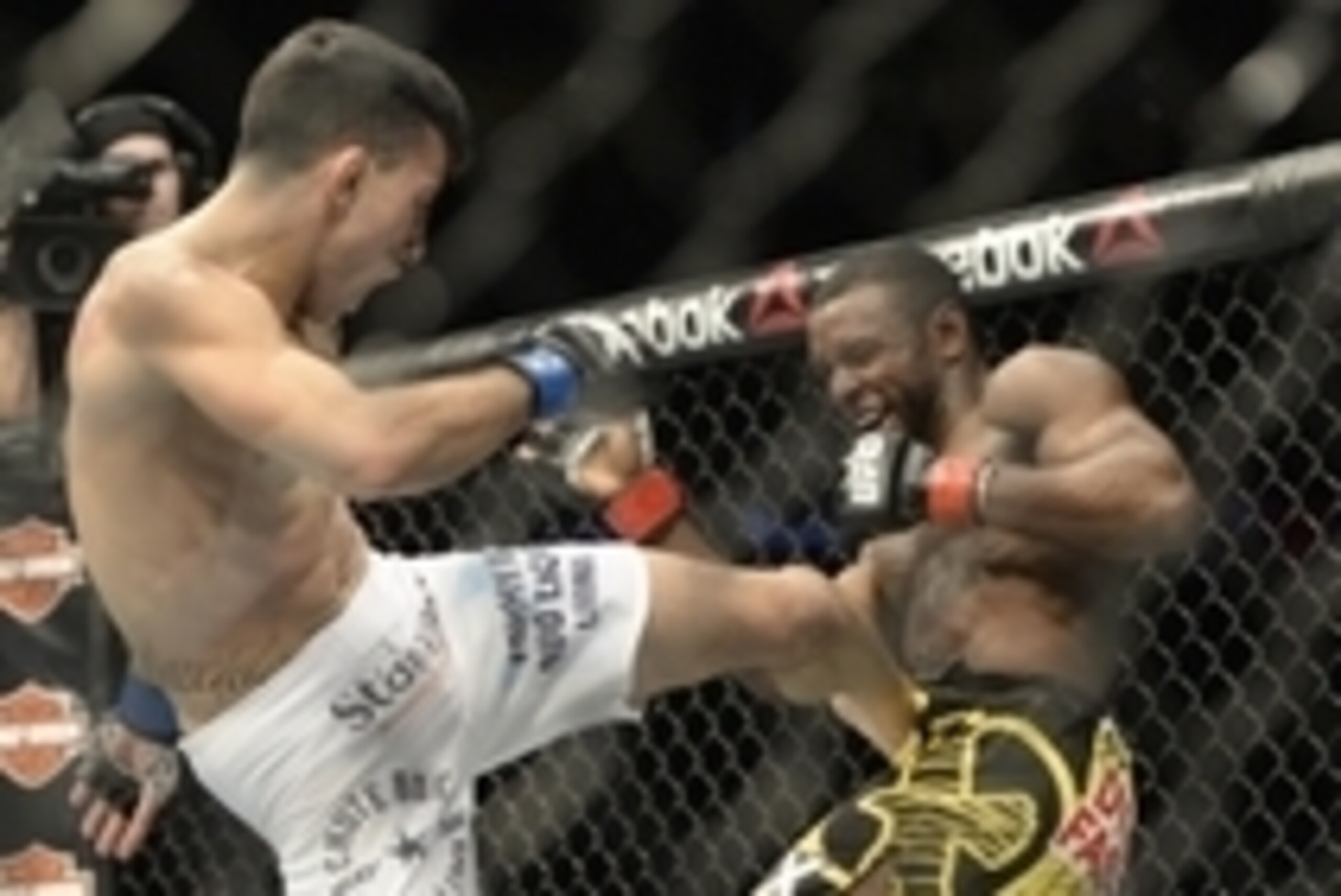 Apr 25, 2015; Montreal, Quebec, CAN; Yves Jabouin (red) and Thomas Almeida (blue) fight during their bantamweight bout during UFC 186 at Bell Centre. Mandatory Credit: Eric Bolte-USA TODAY Sports