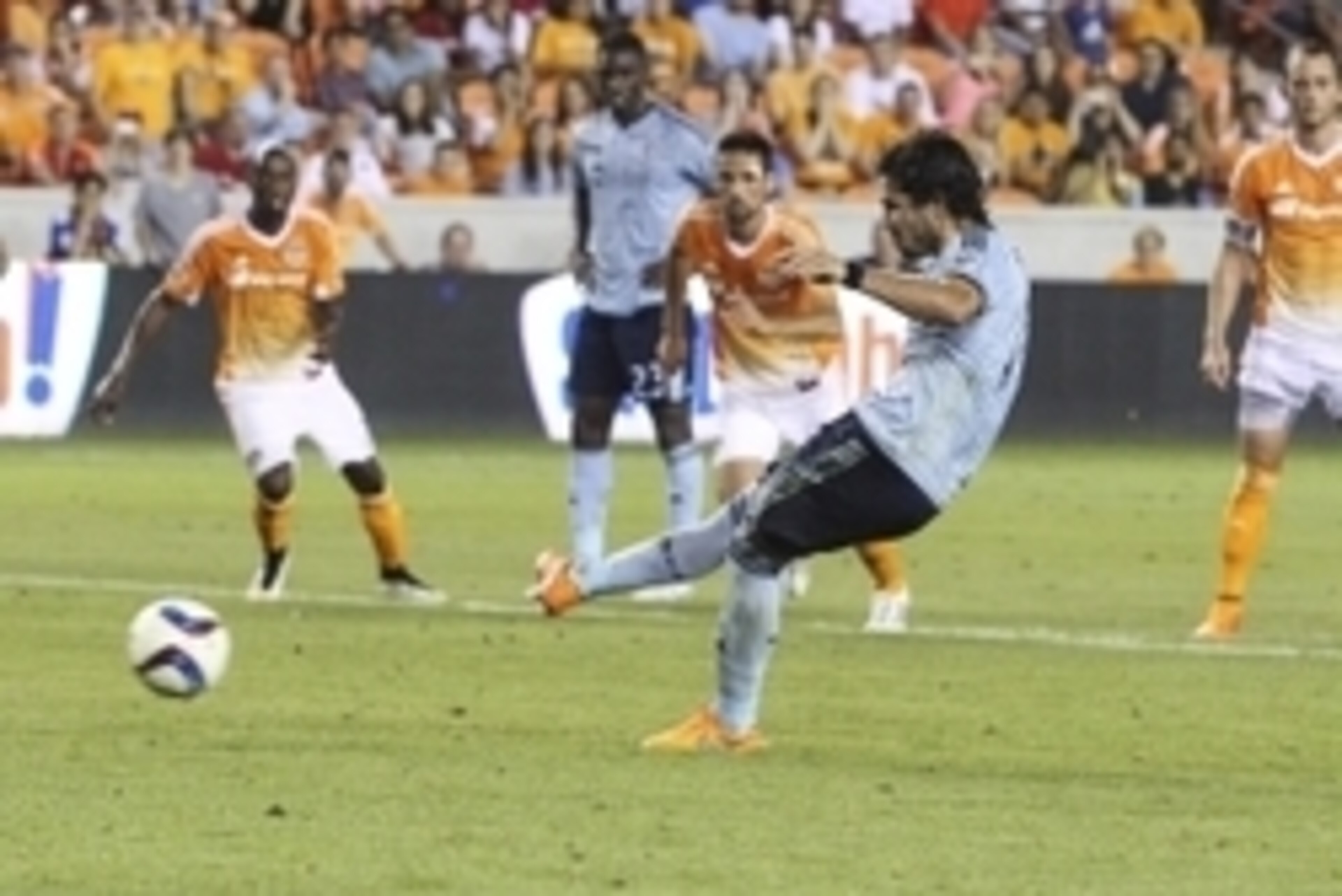 Apr 25, 2015; Houston, TX, USA; Sporting KC midfielder Benny Feilhaber (10) scores a goal on a penalty kick during the second half against the Houston Dynamo at BBVA Compass Stadium. The Dynamo and Sporting KC played to a 4-4 tie. Mandatory Credit: Troy T