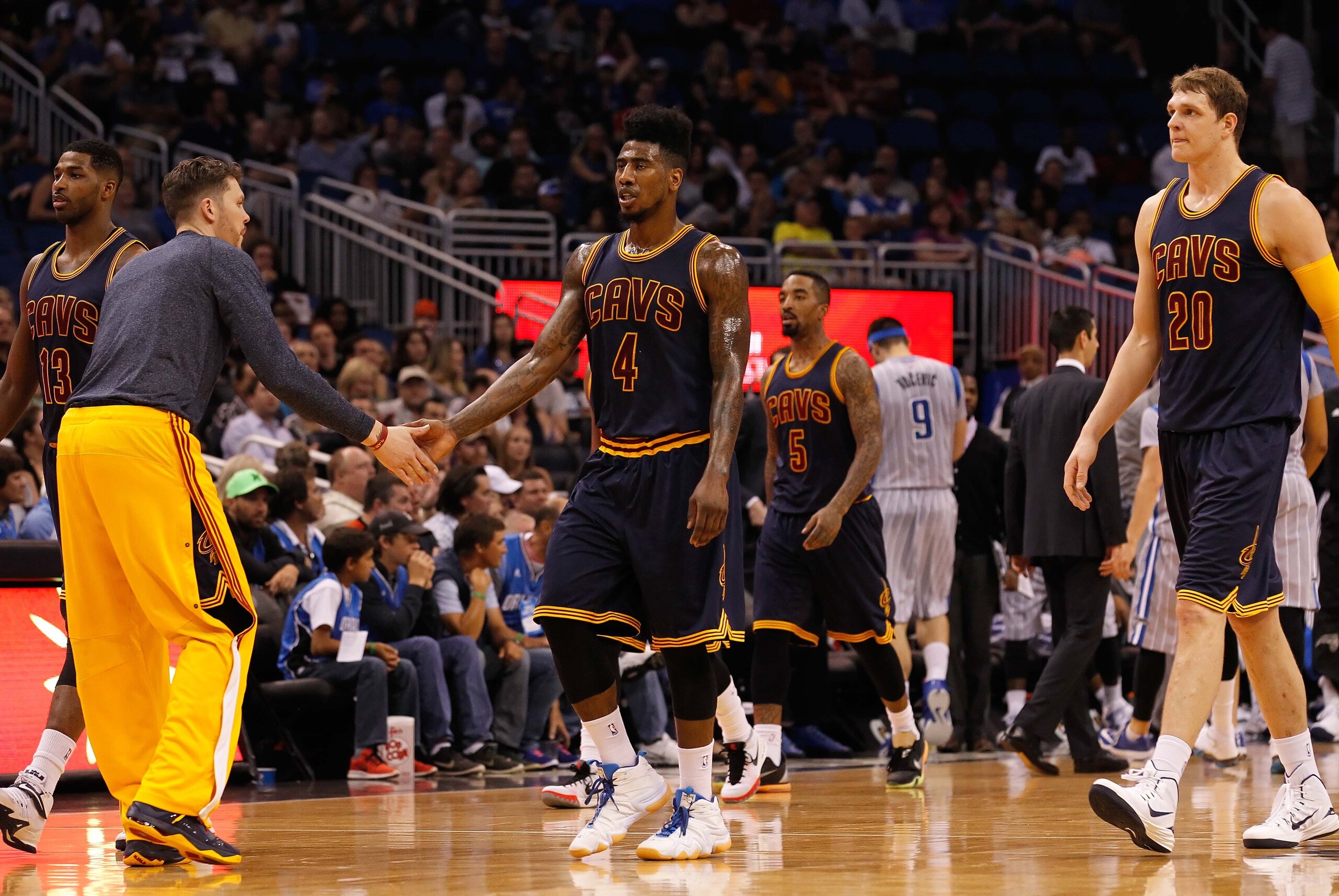 Mar 15, 2015; Orlando, FL, USA;Cleveland Cavaliers guard Iman Shumpert (4) and teammates high five against the Orlando Magic  during the second quarter at Amway Center. Mandatory Credit: Kim Klement-USA TODAY Sports