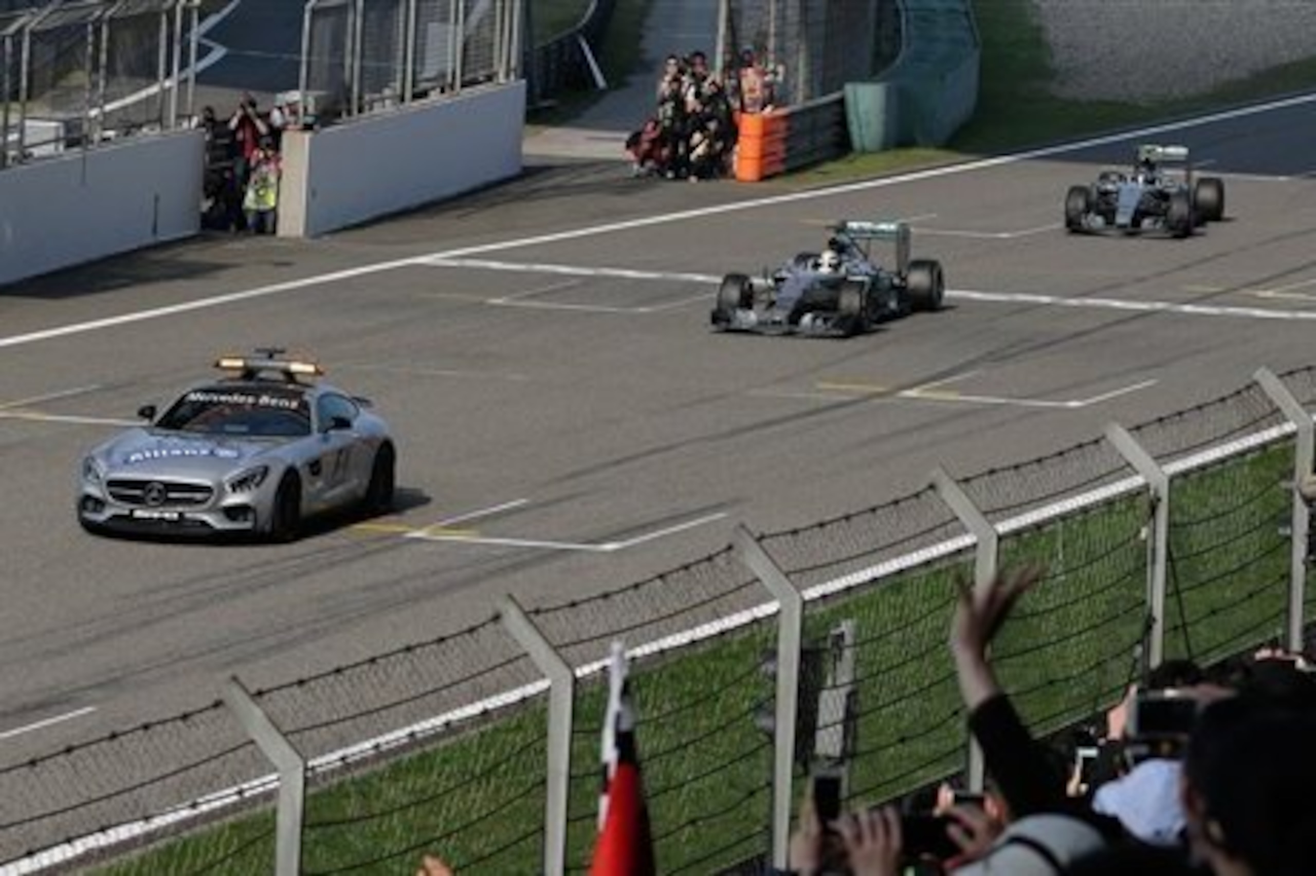 Hamilton and Rsoberg follow the safety car in China.