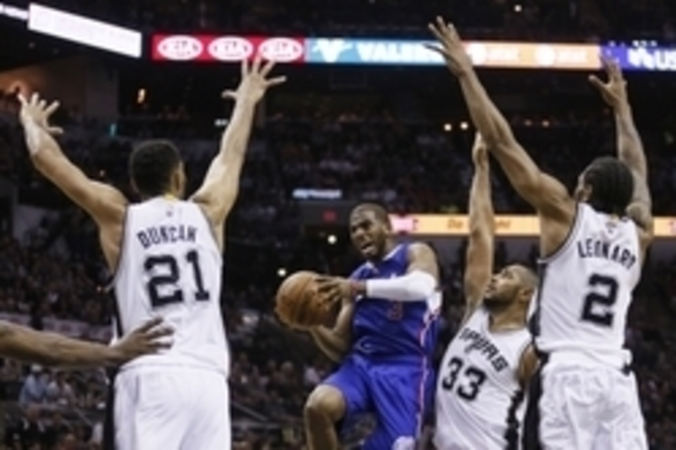Apr 26, 2015; San Antonio, TX, USA; Los Angeles Clippers point guard Chris Paul (3) drives to the basket as San Antonio Spurs power forward Boris Diaw (33) defends in game four of the first round of the NBA Playoffs at AT&T Center. Mandatory Credit: Soobu