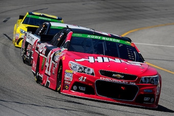 RICHMOND, VA - APRIL 26:  Kurt Busch, driver of the #41 Haas Automation Chevrolet, leads a pack of cars during the NASCAR Sprint Cup Series Toyota Owners 400 at Richmond International Raceway on April 26, 2015 in Richmond, Virginia.  (Photo by Jeff Curry/