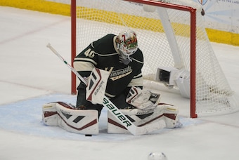 Apr 26, 2015; Saint Paul, MN, USA;  Minnesota Wild goalie Devan Dubnyk (40) makes a save during the third period in game six of the first round of the 2015 Stanley Cup Playoffs at Xcel Energy Center.  The Wild defeated the Blues 4-1 advancing them to the