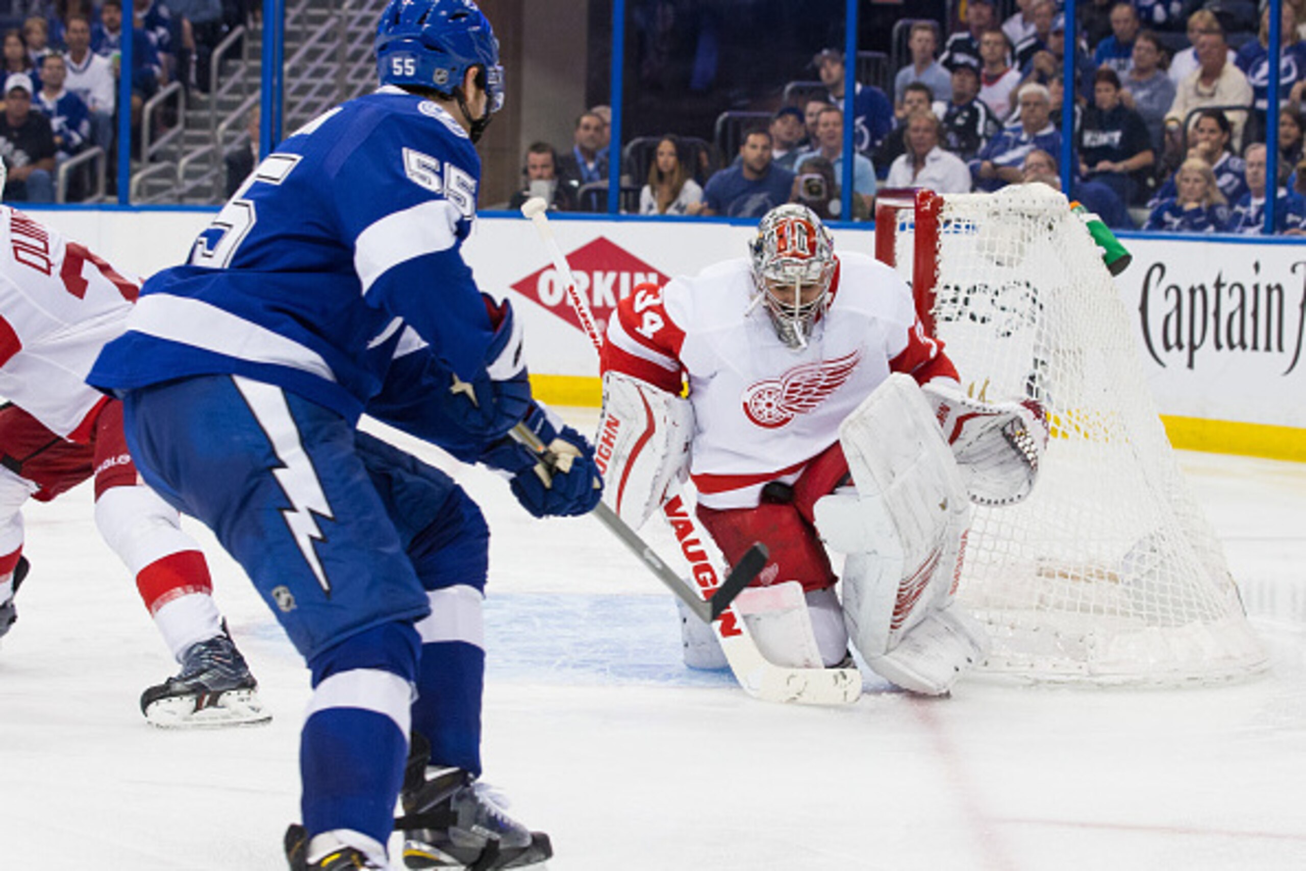TAMPA, FL - APRIL 25: Braydon Coburn #55 of the Tampa Bay Lightning shoots the puck against goalie Petr Mrazek #34 of the Detroit Red Wings during the third period of Game Five of the Eastern Conference Quarterfinals during the 2015 NHL Stanley Cup Playof