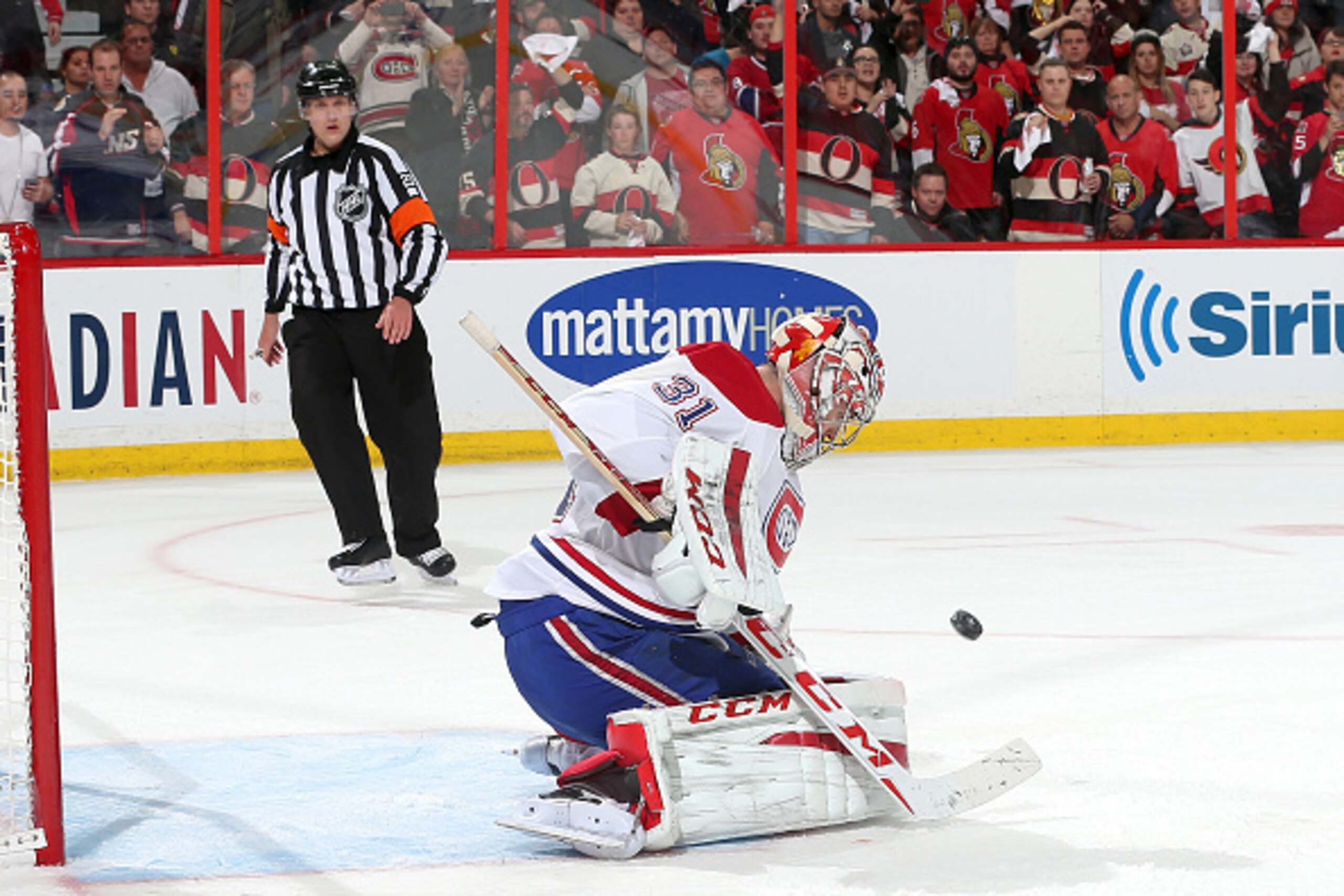 OTTAWA, ON - APRIL 26: Carey Price #31 of the Montreal Canadiens makes one of his forty-three saves against the Ottawa Senators in Game Six of the Eastern Conference Quarterfinals during the 2015 NHL Stanley Cup Playoffs at Canadian Tire Centre on April 2